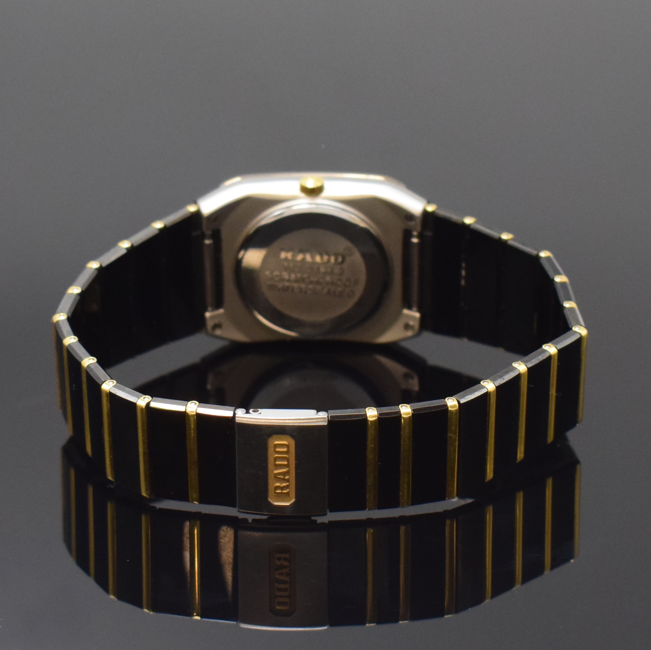 Detail b: RADO Jubile Armbanduhr Referenz 152.0398.3, Schweiz um 1995, quarz, Edelstahlgeh., Boden aufgedr., Keramik-Gliederband z. T. m. Gold verz., dopp. ...