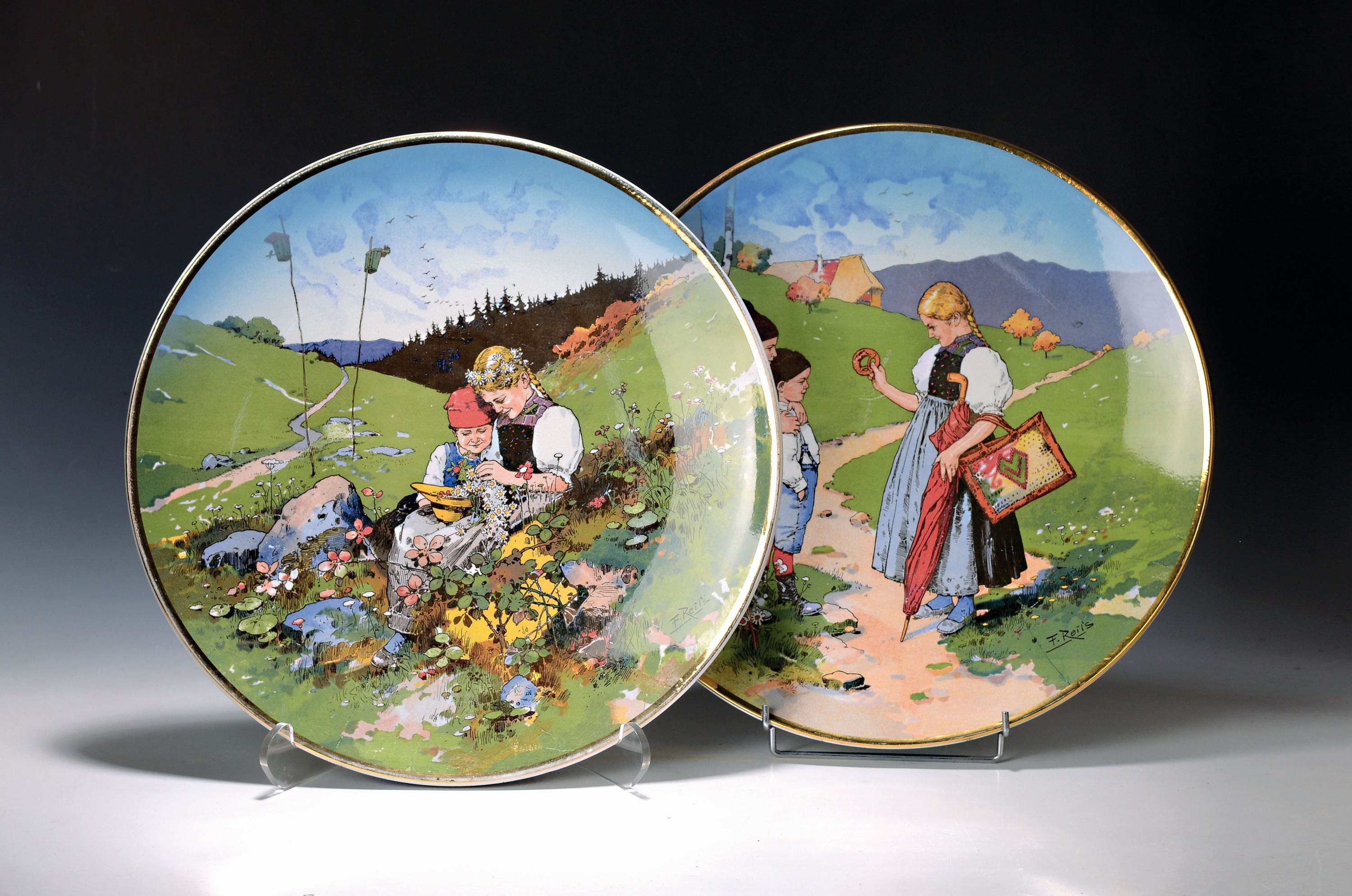 2 große Teller, Villeroy & Boch Mettlach, Nr. 1099/1044 und 1100/1044, sign. F. Reils, Feinsteingut, bunt staffiert mit Kindern in ...