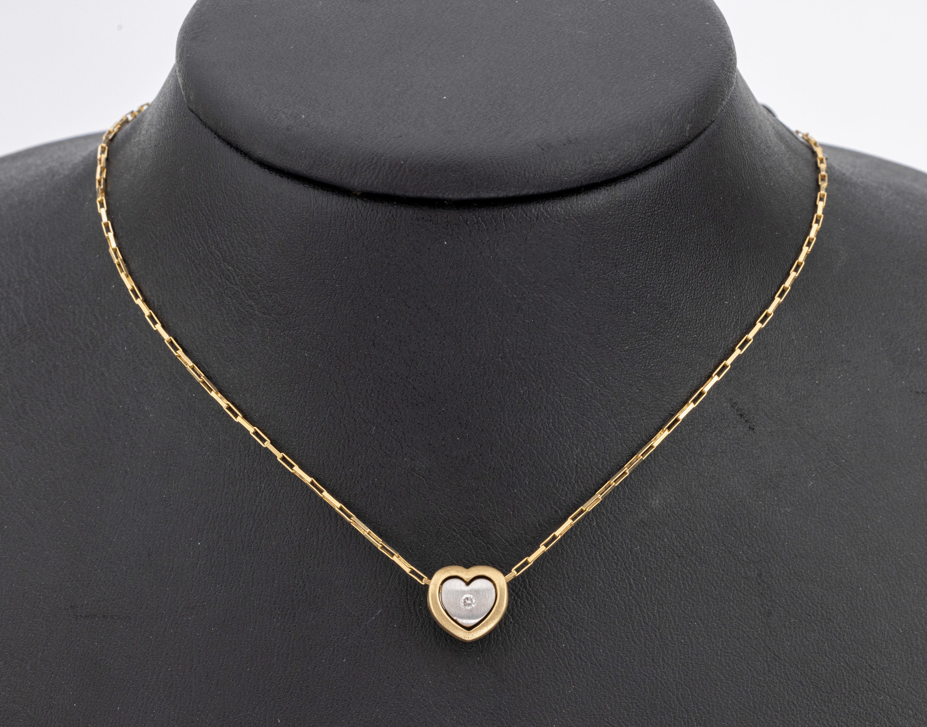 14 kt Gold Brillant-Herzanhänger, GG/WG 585/000, Brillant in WG gefasst ca. 0.03 ct Weiss/si, an Kette, GG 585/000, L. ca. 45 cm, ...