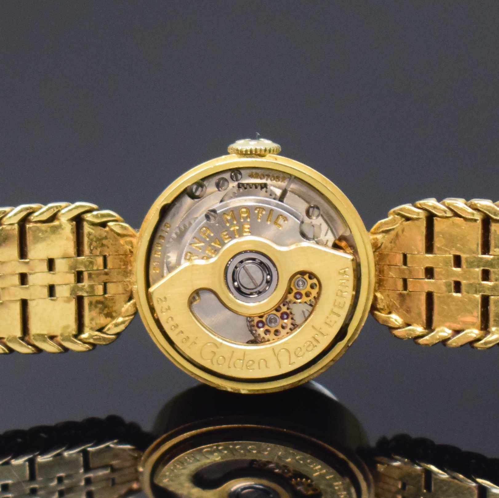 Detail e: ETERNA Golden Heart seltene Damenarmbanduhr in GG 750/000, Schweiz um 1955, Automatik, 2-tlg. Geh., Boden aufgedr., anges. orig. Gliederband m. ...