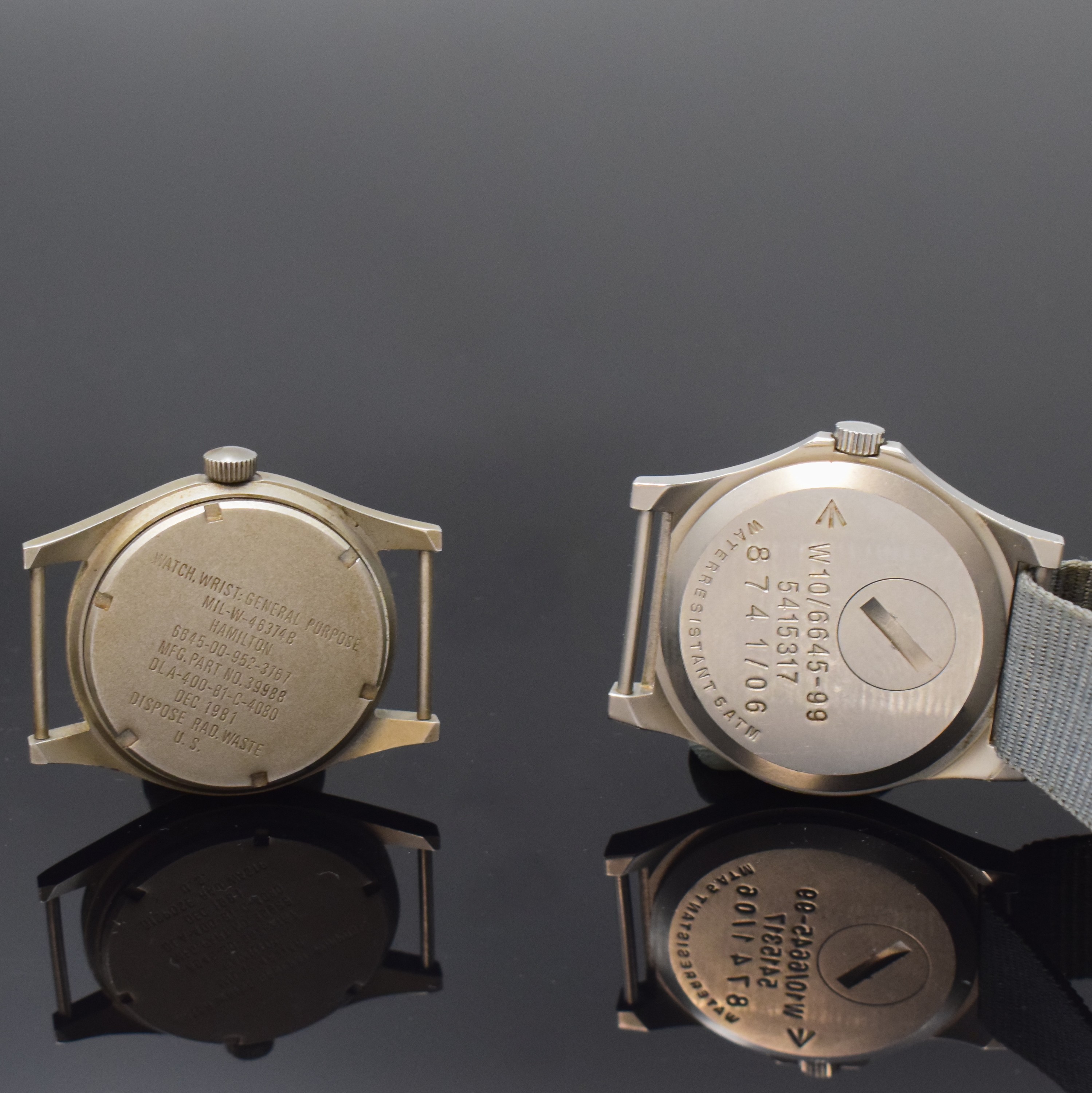 Detail c: HAMILTON / CWC 2 Militär-Armbanduhren, Schweiz / USA ca. 1981/2006, Handaufzug / Quarz, mattierte Geh., feste Anstösse, Böden m. Militärgrav., ...