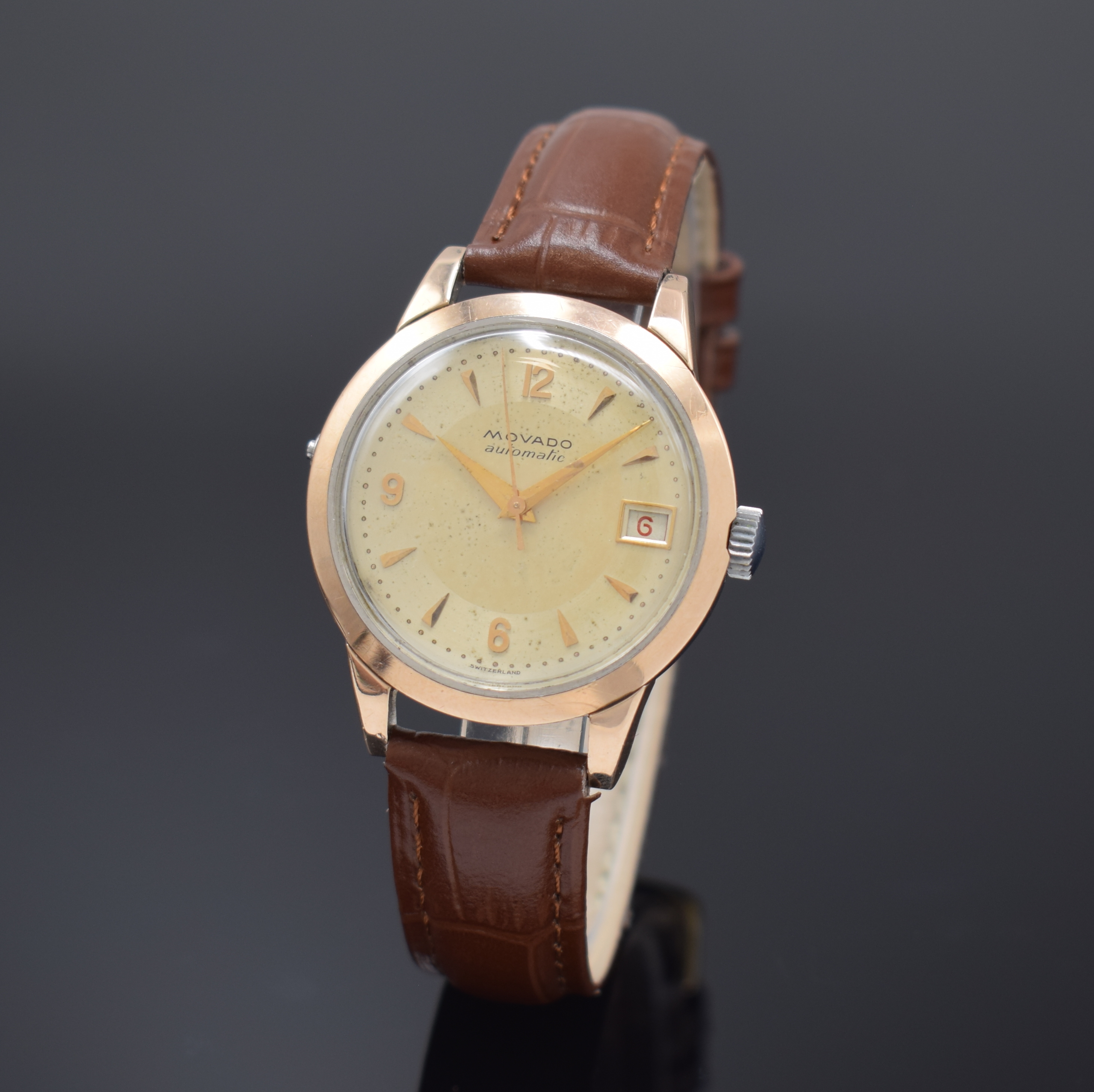 MOVADO Herrenarmbanduhr Referenz 16280, Schweiz um 1952, Hammerautomatik, Edelstahlgeh. mit Goldhaube, Boden verschr., Zifferbl. m. aufgel. Indizes ...