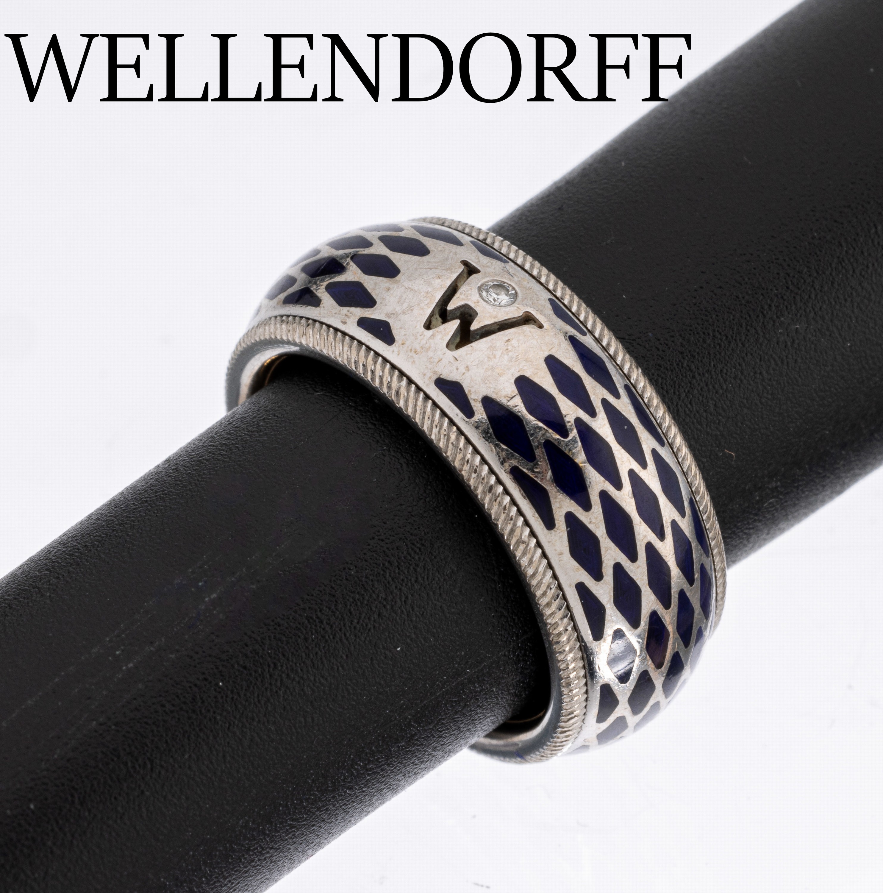 18 kt Gold WELLENDORFF Ring, WG/GG 750/000,Modell Horizont, Ringschiene drehbar, blaues Email, RW 53, ca. 17.6 g, sign., in orig. Holzetui, mit ...