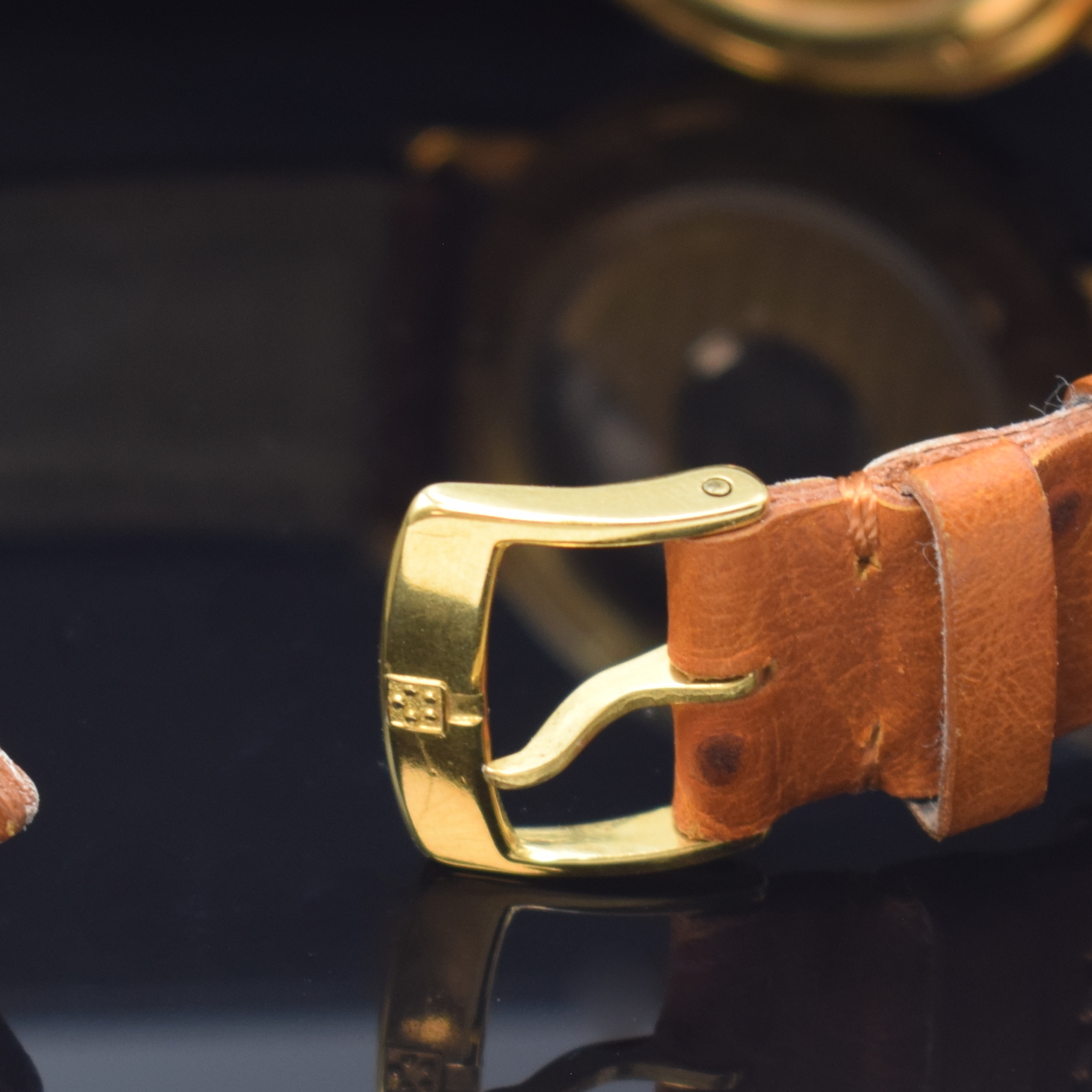 Detail b: ETERNA MATIC Herrenarmbanduhr mit Gangreserveanzeige und GMT in GG 750/000, Automatik, Schweiz um 1995, massives Geh. beids. vergl., Lederband m. ...