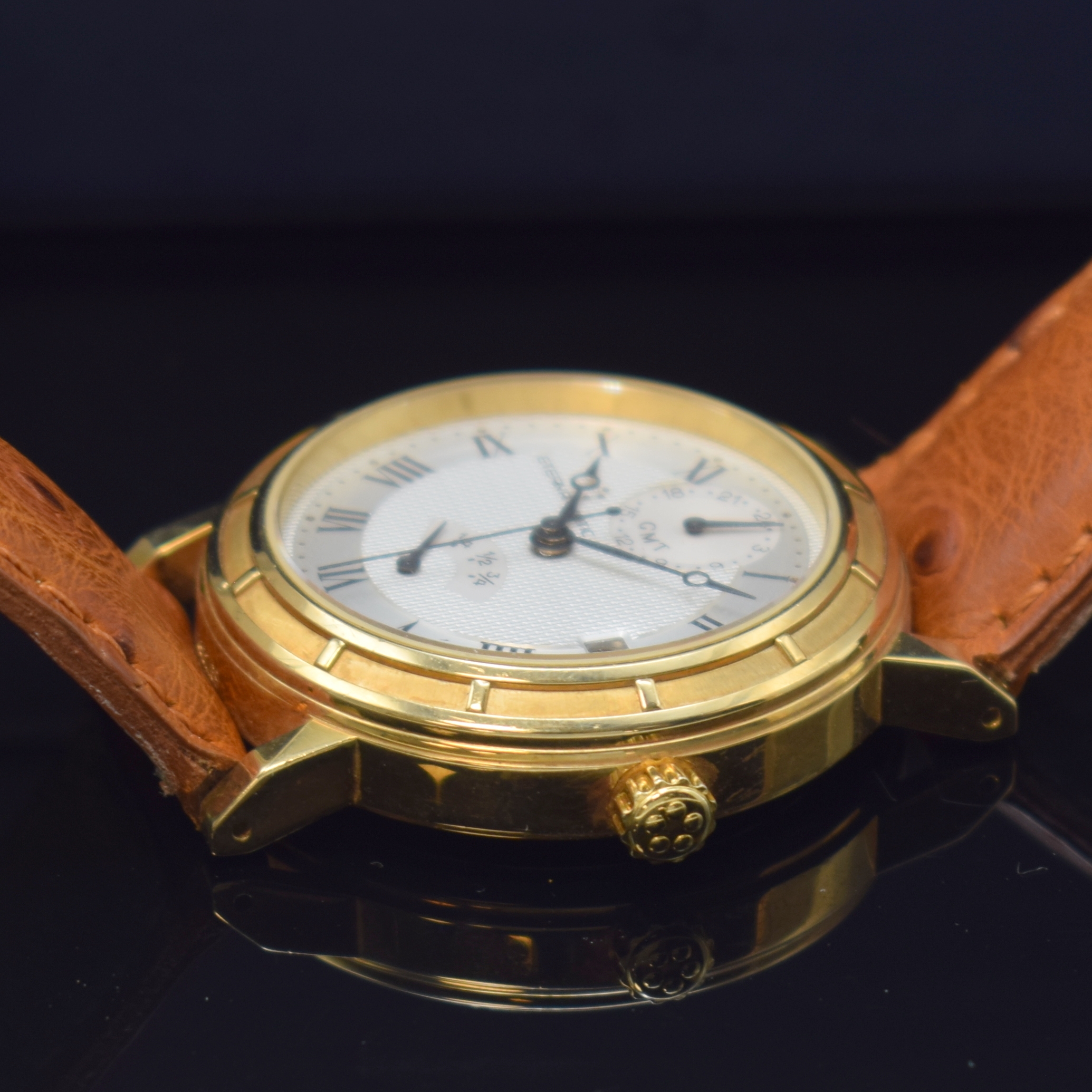 Detail c: ETERNA MATIC Herrenarmbanduhr mit Gangreserveanzeige und GMT in GG 750/000, Automatik, Schweiz um 1995, massives Geh. beids. vergl., Lederband m. ...