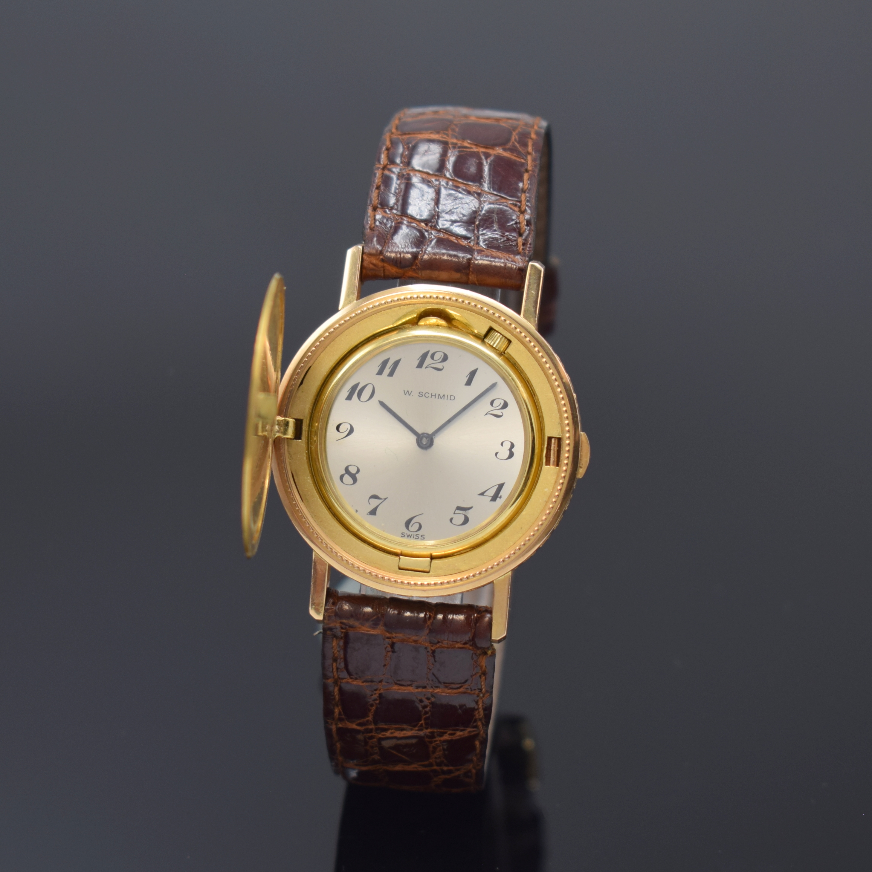 W. SCHMID seltene 10 US-Dollar Savonette- Armbanduhr, Handaufzug, Schweiz um 1980, ausgehöhlte 10 Dollarmünze v. 1912 m. ausklappbarem Werk, ...