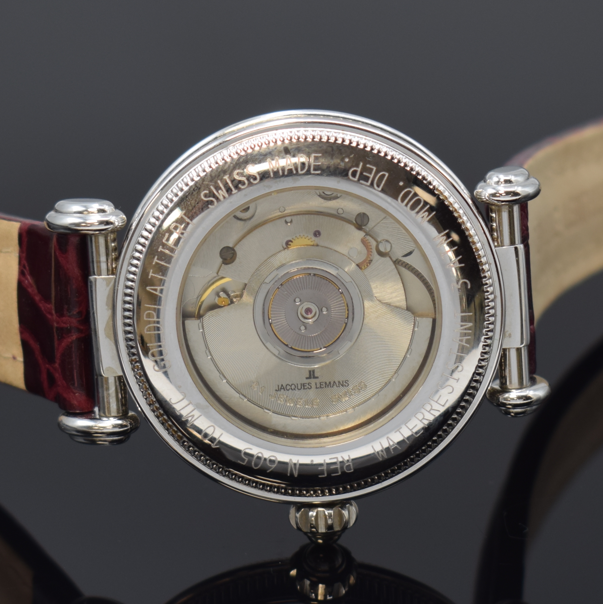 Detail d: JAQUES LEMANS Herrenarmbanduhr Worldtimer Referenz 605, Automatik, Schweiz um 1995, weiss-verg. Metallgeh. inkl. orig. Lederband m.orig. Dornschl., ...