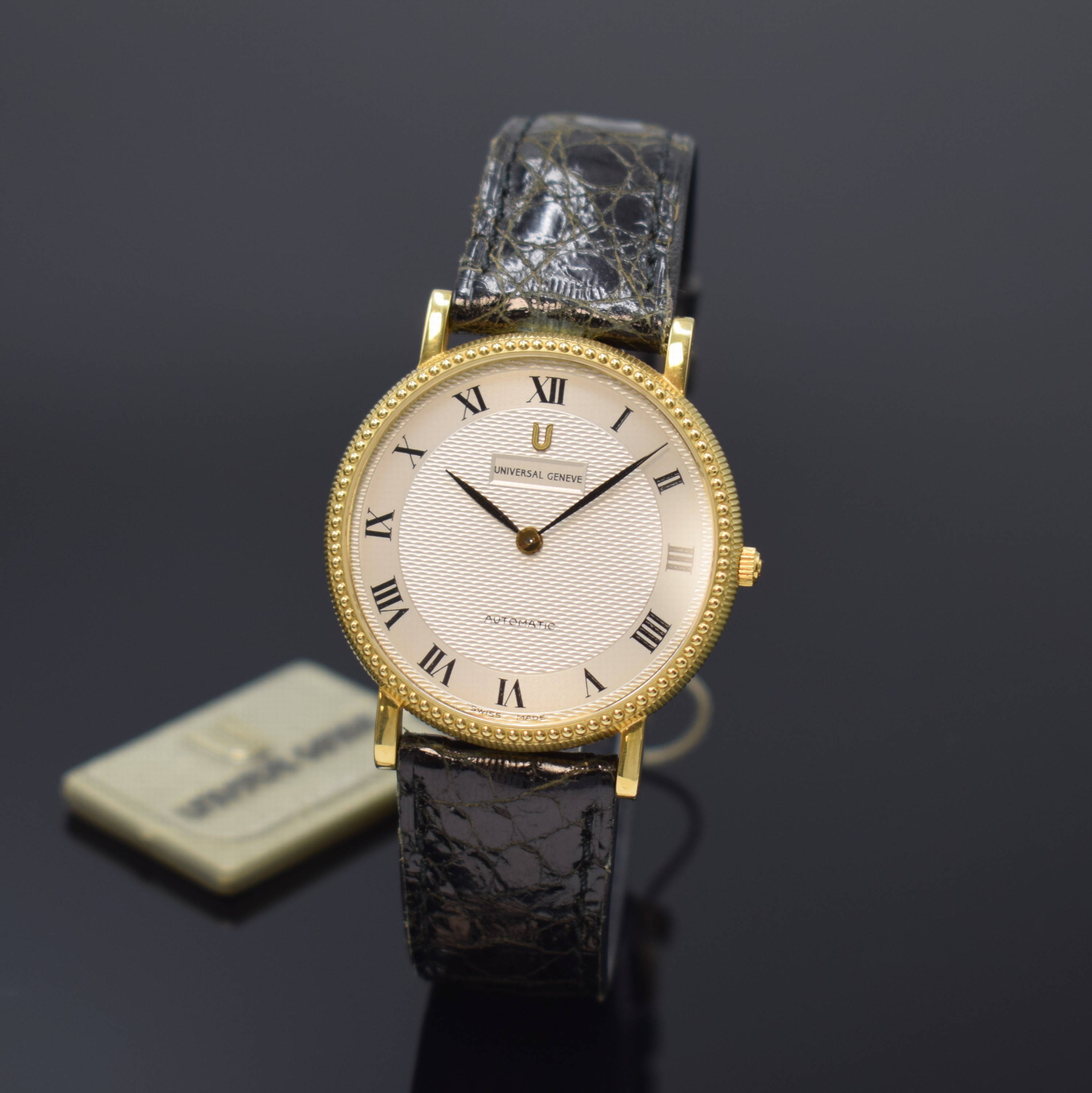 UNIVERSAL GENEVE Herrenarmbanduhr in GG 750/000 Referenz 151-11-661, Automatik, Schweiz um 1990, beids. vergl., Boden aufgedr., Perllünette, ...