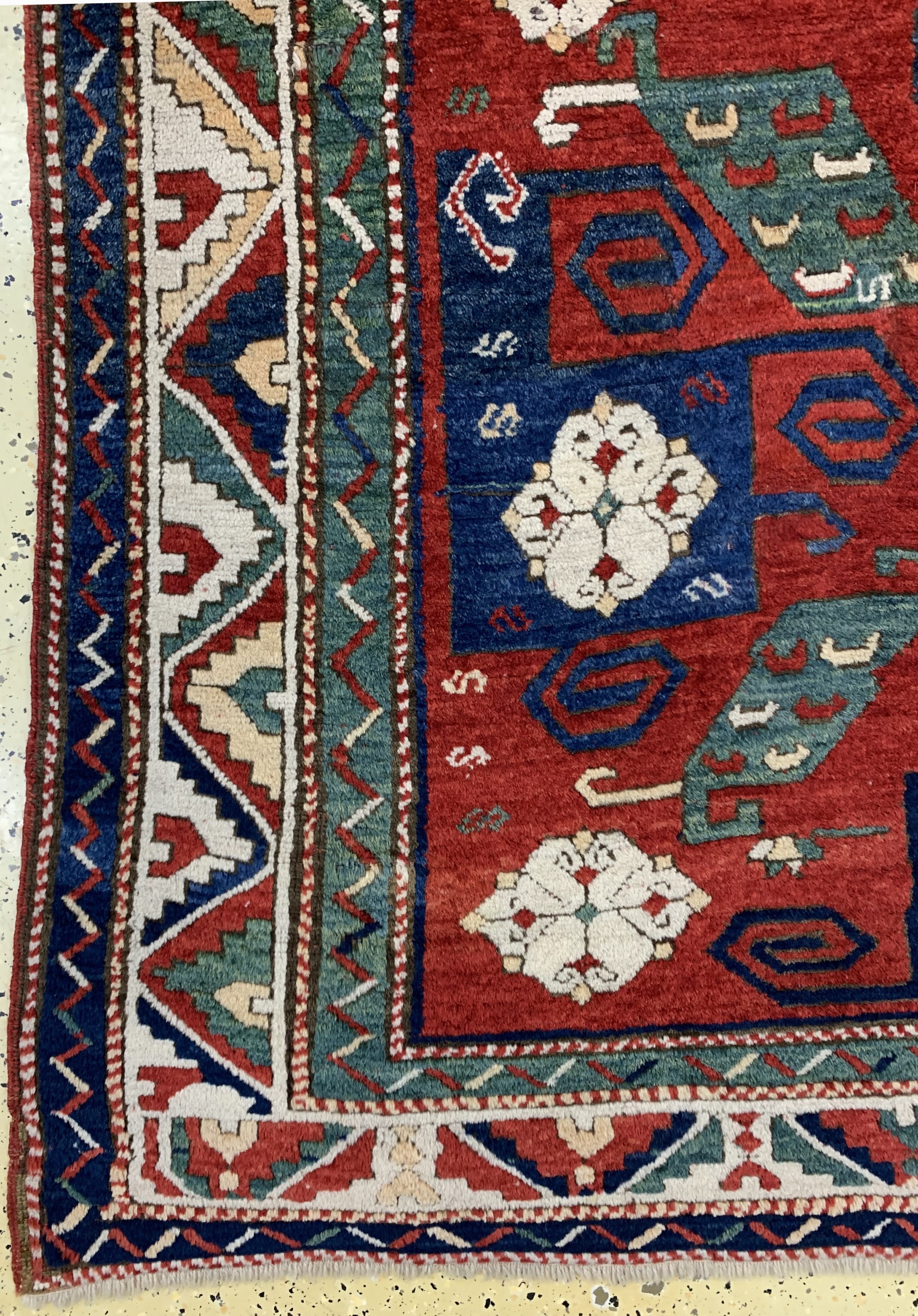 Detail c: "Pinwheel"kazak antik, (Swastika), Kaukasus, Mitte 19.Jhd, Wolle auf Wolle, ca. 230 x 170 cm, EHZ: 2, (kleine alte Restaurierungen).