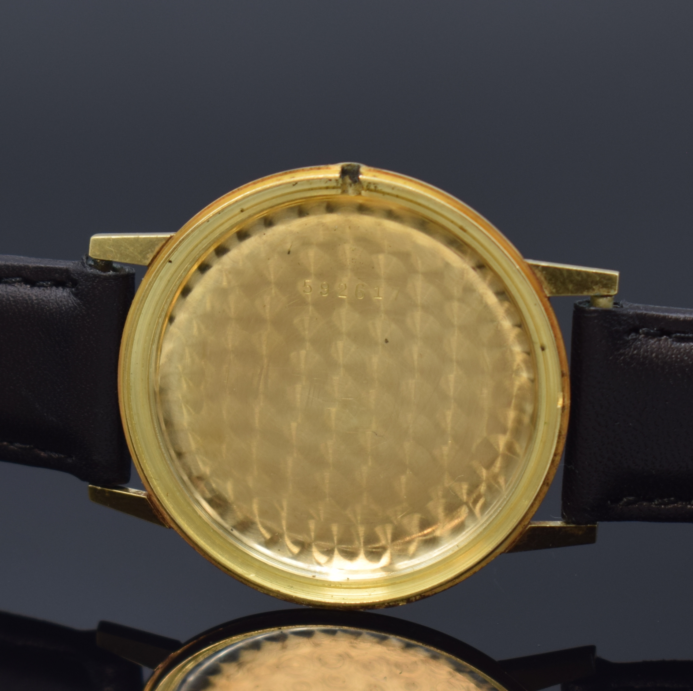 Detail d: GRUEN Herrenarmbanduhr in GG 750/000, Schweiz um 1965, Handaufzug, Glasrand aufgedr., silb. Zifferbl. m. 4 gold. Std.-Ind. , gold. Zeiger, Kal. AS ...