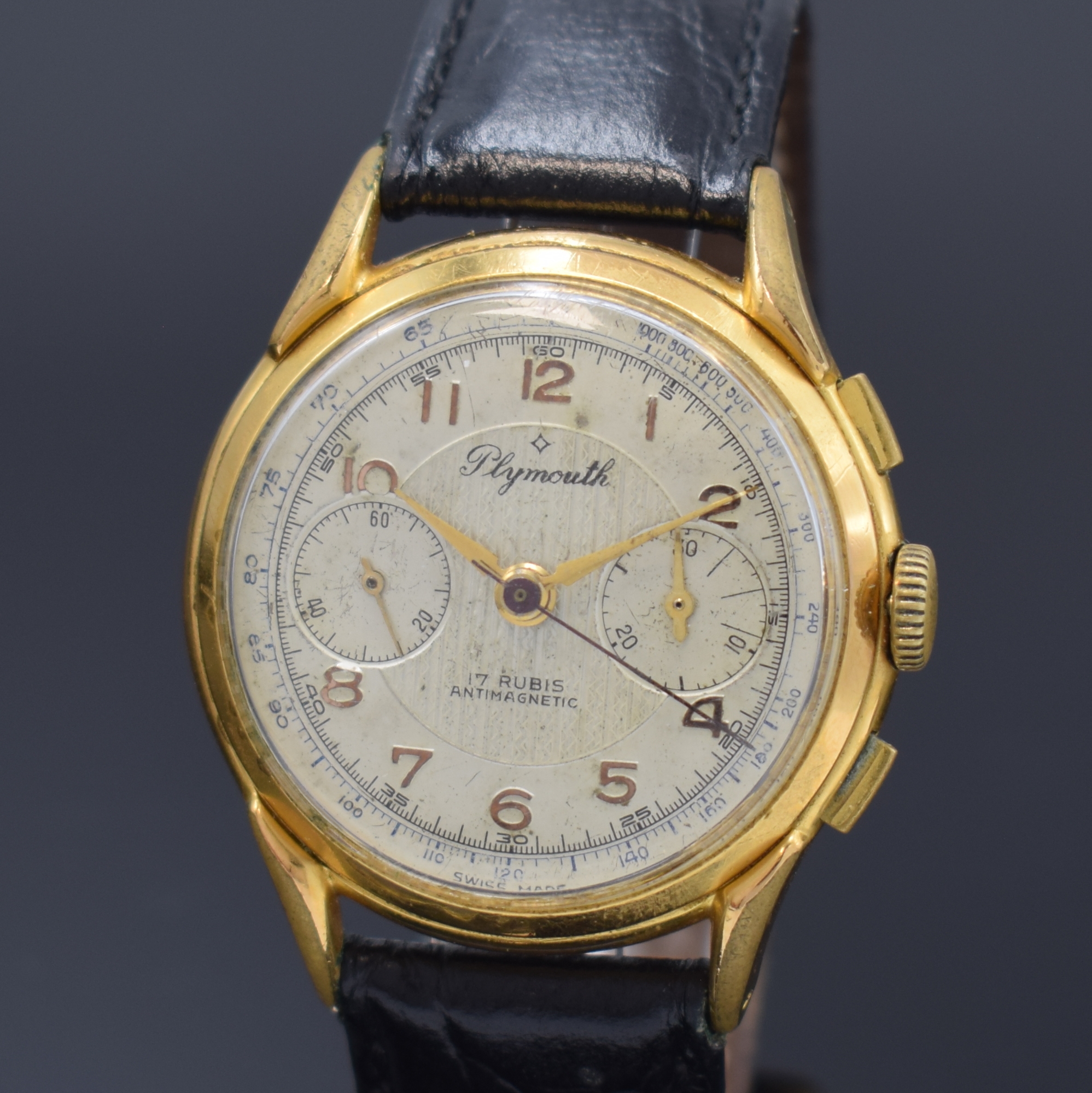 Detail a: PLYMOUTH Armbandchronograph, Schweiz um 1950, Handaufzug, verg. Geh., Edelstahlboden aufgedr., silb. Zifferbl. altersbed. fl., gold. arab. Zahlen, ...