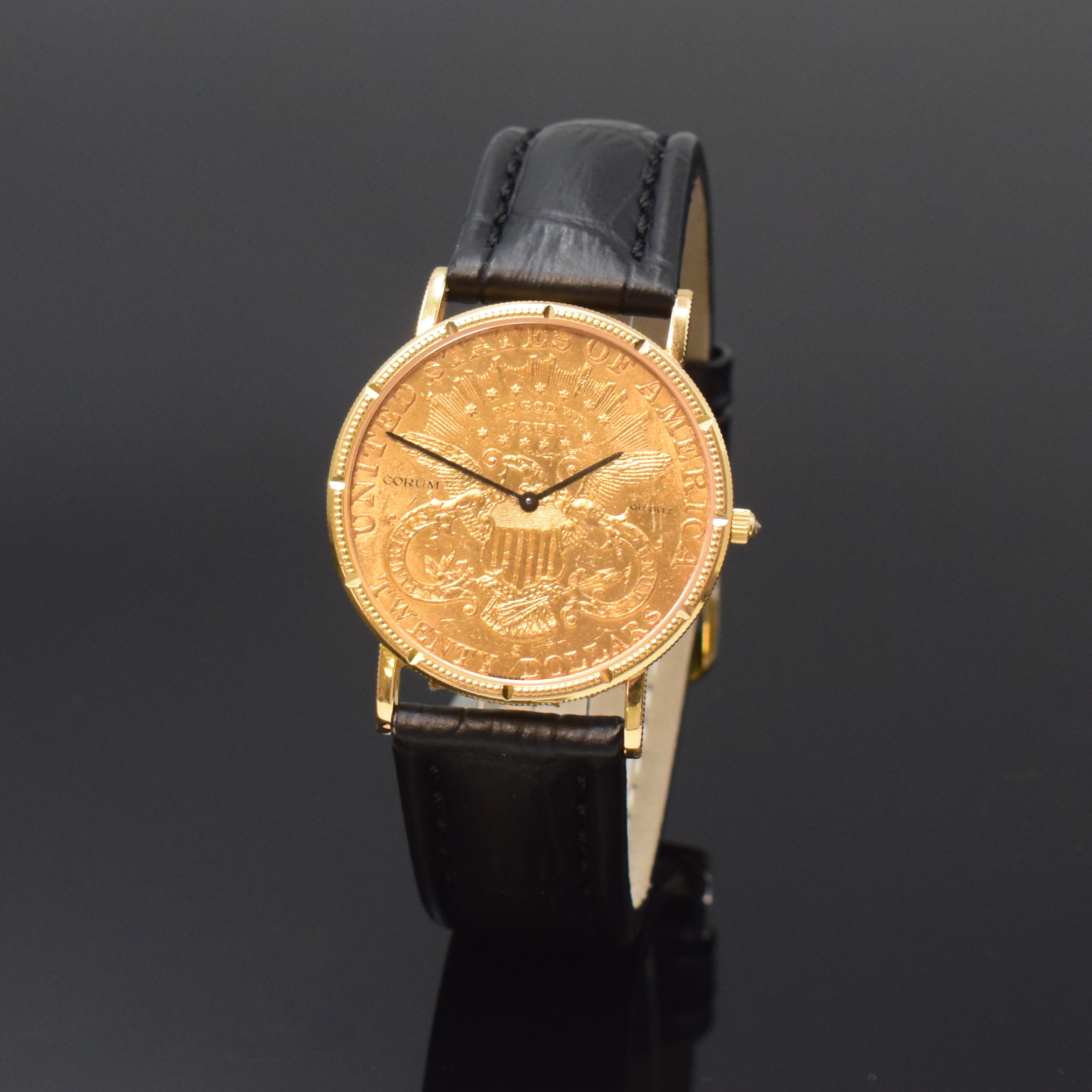 CORUM Twenty Dollars 1904 Herrenarmbanduhr sogenannte Coinwatch, Schweiz um 1980, quarz, in Form einer 20 US-Dollarmünze Golden Eagle, GG 750/000 ...