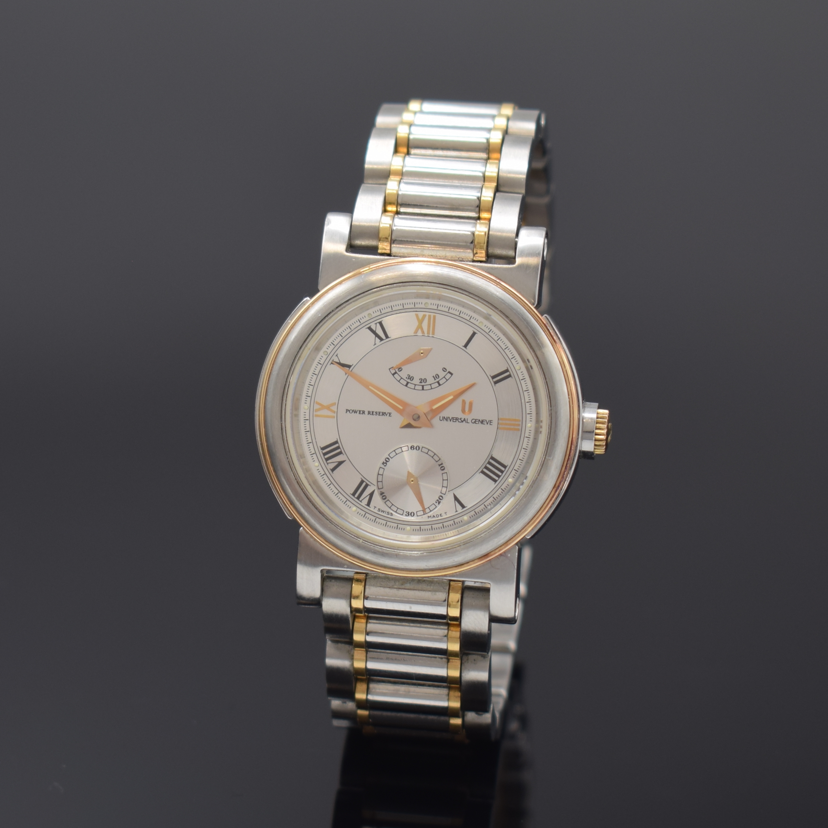 UNIVERSAL GENEVE Armbanduhr in Stahl/Gold mit Gangreserve, Schweiz um 1990, Handaufzug, beids. verg. Geh., orig. Gliederband m. Faltschl., Lünette ...