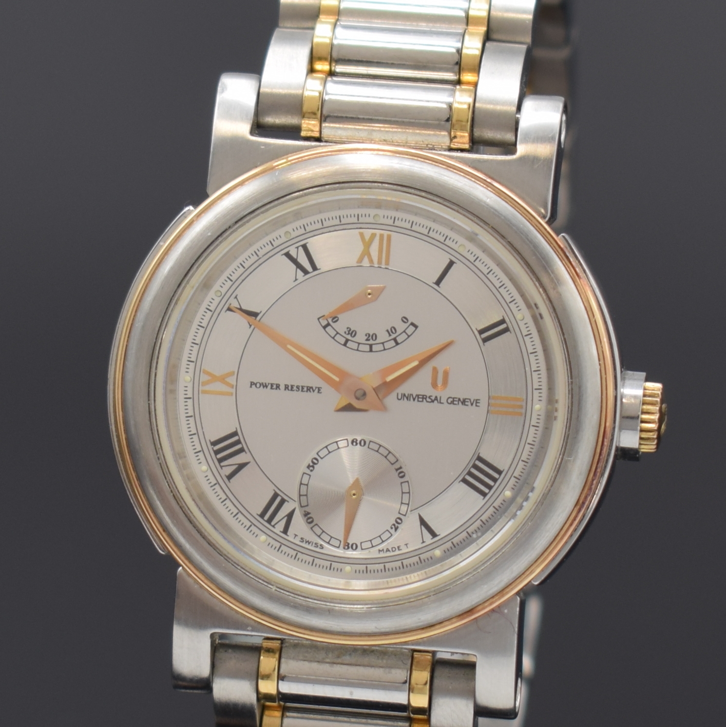 Detail a: UNIVERSAL GENEVE Armbanduhr in Stahl/Gold mit Gangreserve, Schweiz um 1990, Handaufzug, beids. verg. Geh., orig. Gliederband m. Faltschl., Lünette ...