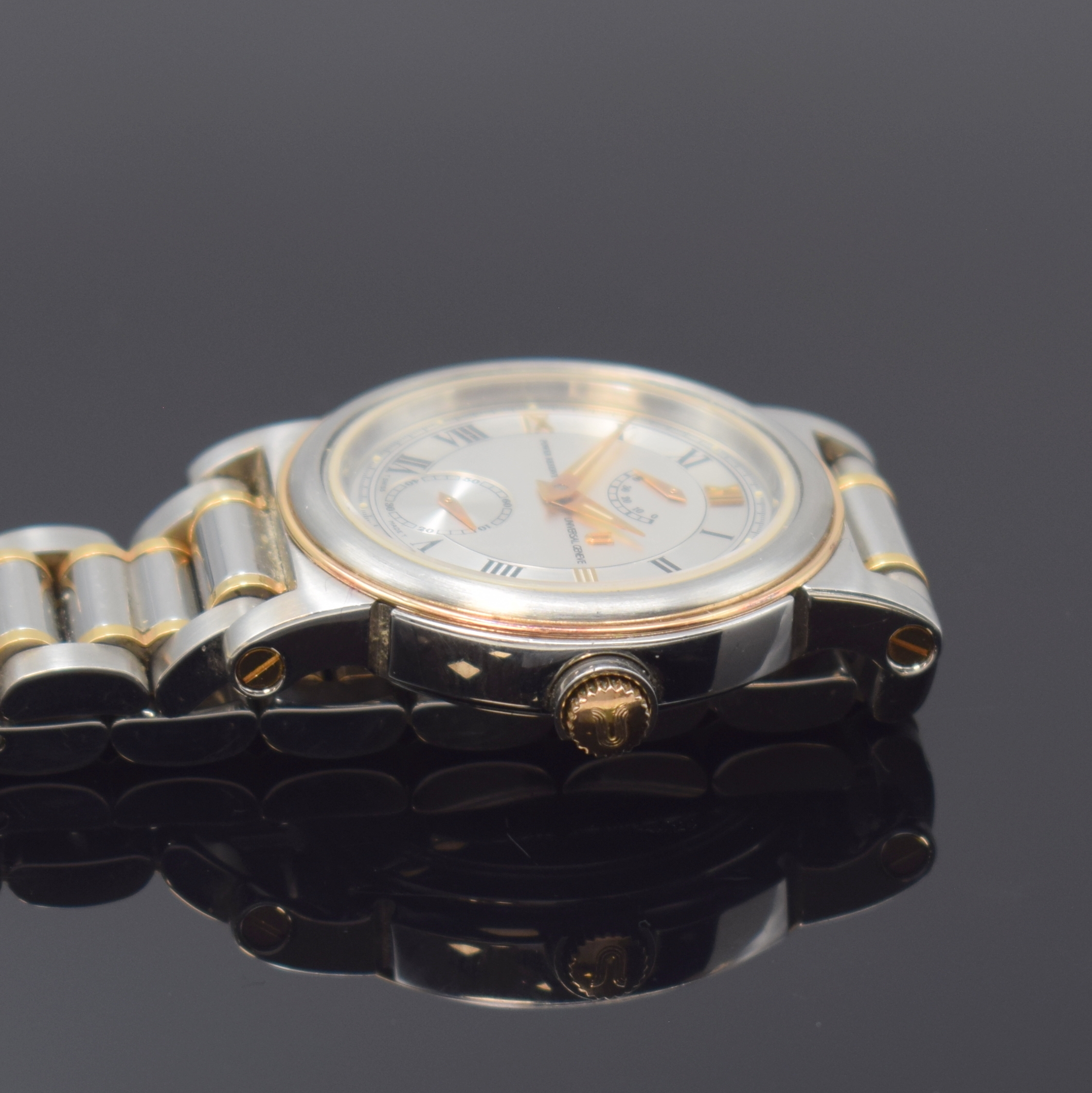 Detail c: UNIVERSAL GENEVE Armbanduhr in Stahl/Gold mit Gangreserve, Schweiz um 1990, Handaufzug, beids. verg. Geh., orig. Gliederband m. Faltschl., Lünette ...