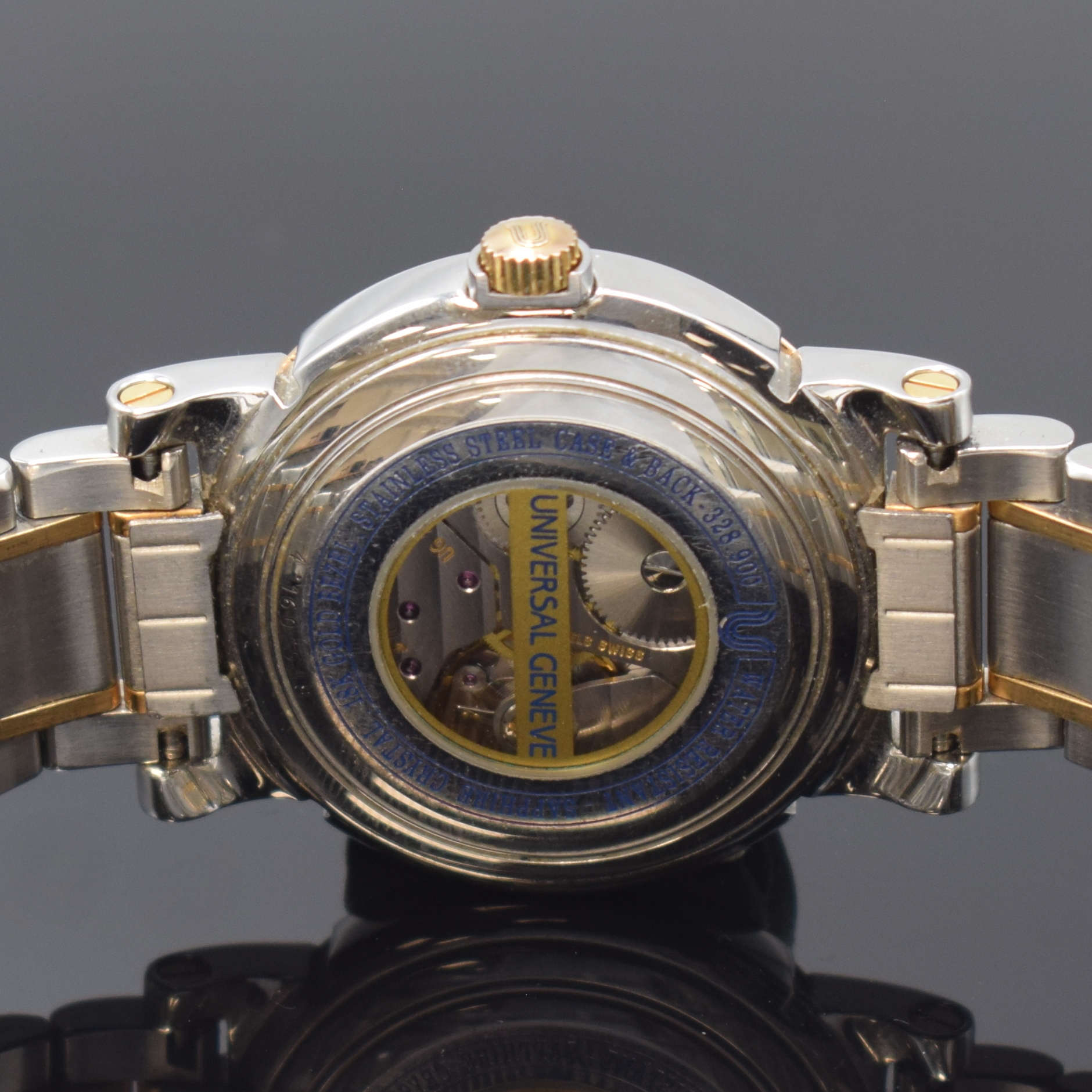 Detail d: UNIVERSAL GENEVE Armbanduhr in Stahl/Gold mit Gangreserve, Schweiz um 1990, Handaufzug, beids. verg. Geh., orig. Gliederband m. Faltschl., Lünette ...