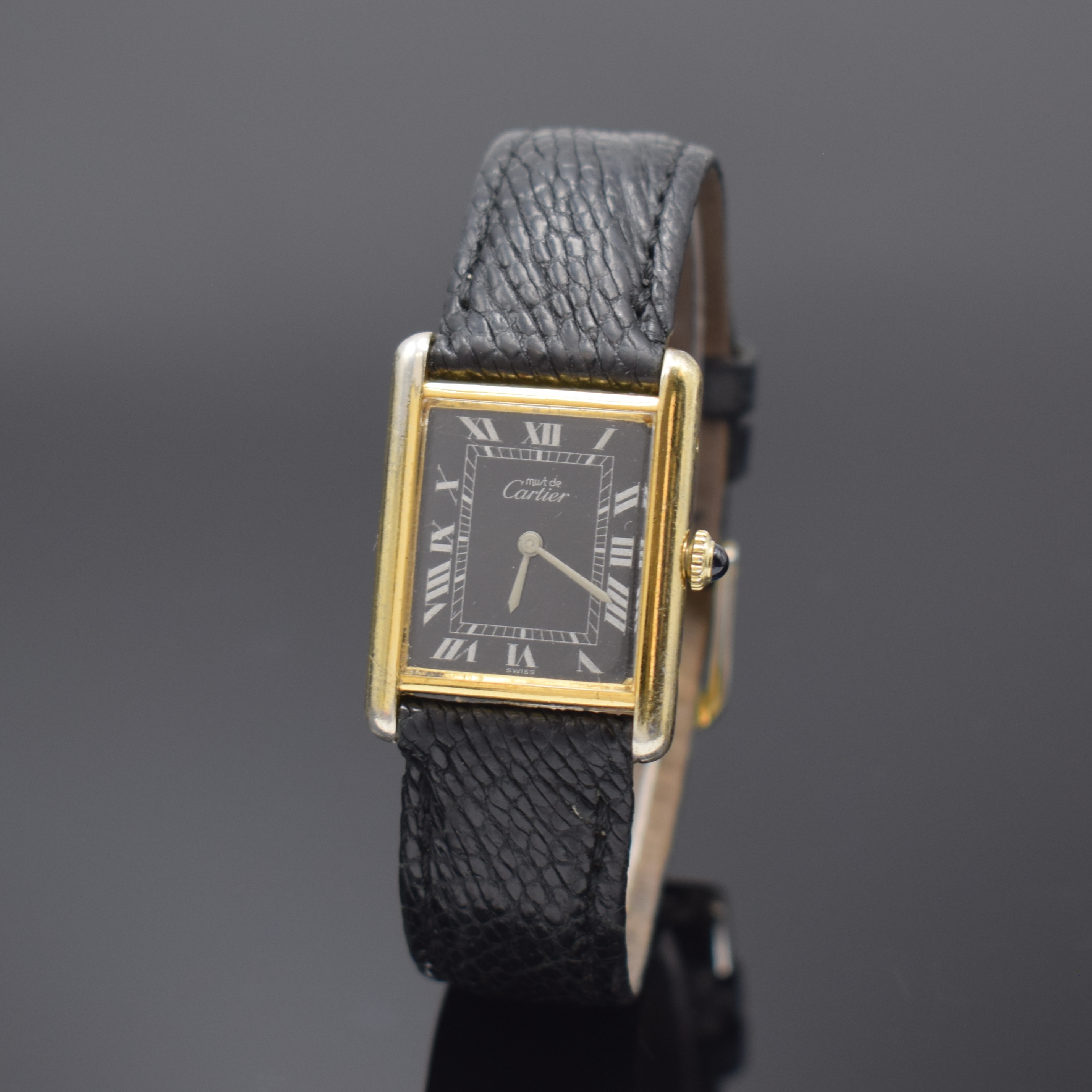 CARTIER Tank Damenarmbanduhr, Schweiz um 1995, Handaufzug, Gehäuse in 925er Silber, seitlich 4-fach verschr., schwarzes Zifferbl. riss., m. röm. ...