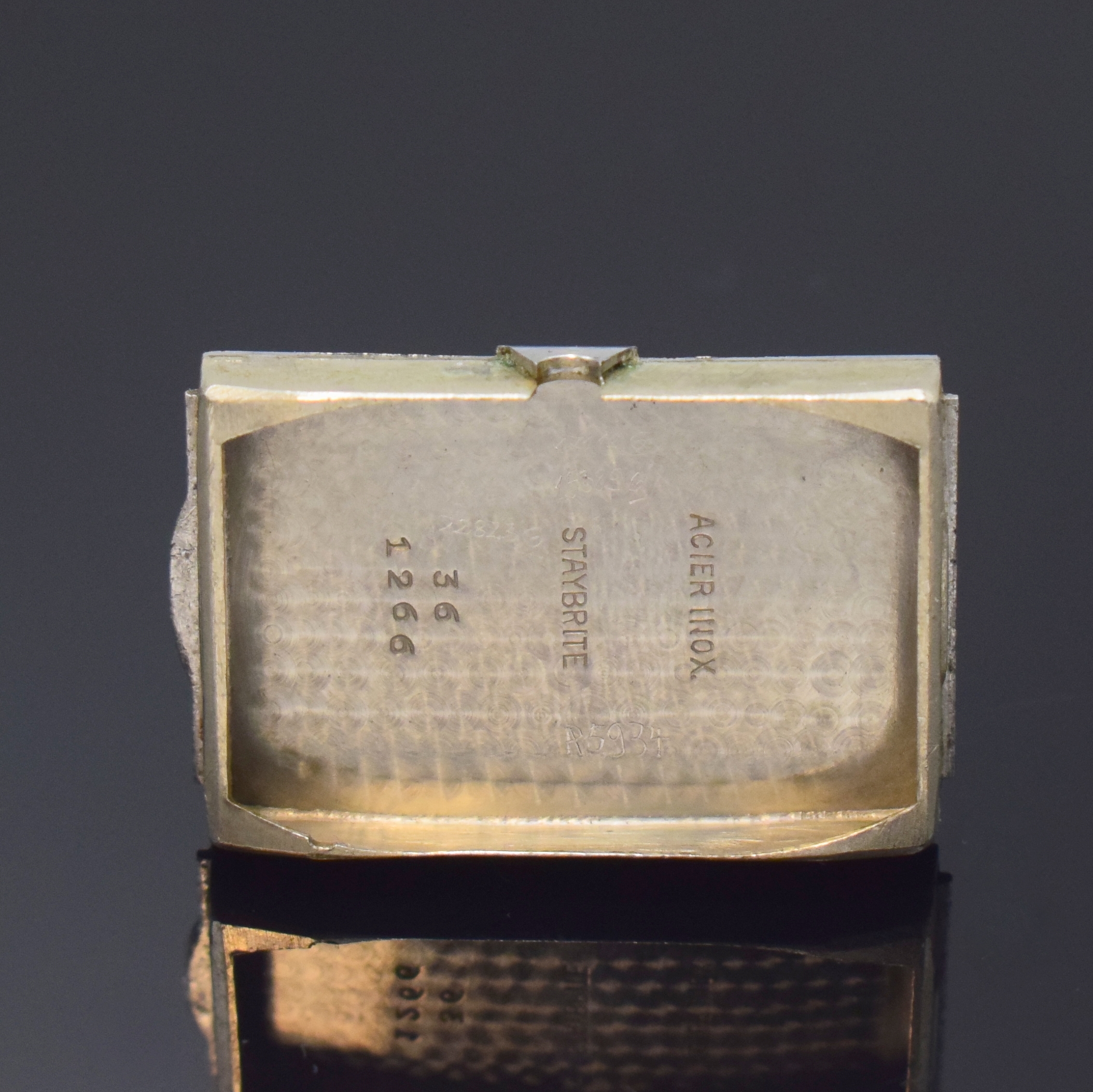 Detail d: LONGINES rechteckige Armbanduhr Referenz 1266 in Stahl, Schweiz um 1936, Handaufzug, seltenes unpoliertes Geh., Boden aufgedr., silb. orig. Zifferbl. ...
