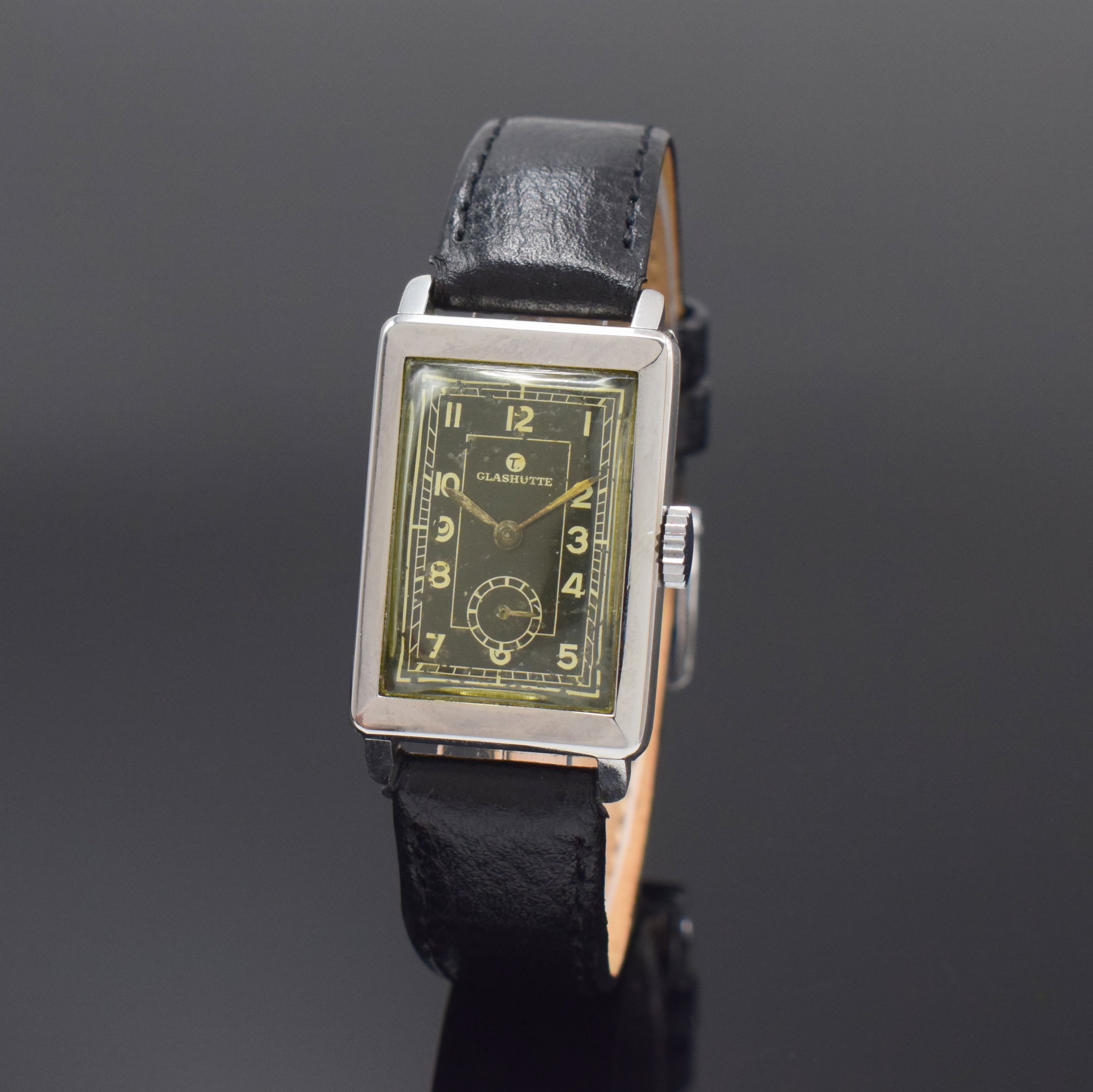 TUTIMA rechteckige Armbanduhr in Stahl Kaliber UROFA 58, Deutschland um 1935, Handaufzug, Scharniergeh. rücks. bez."Uhrenfabrik AG Glashütte ...