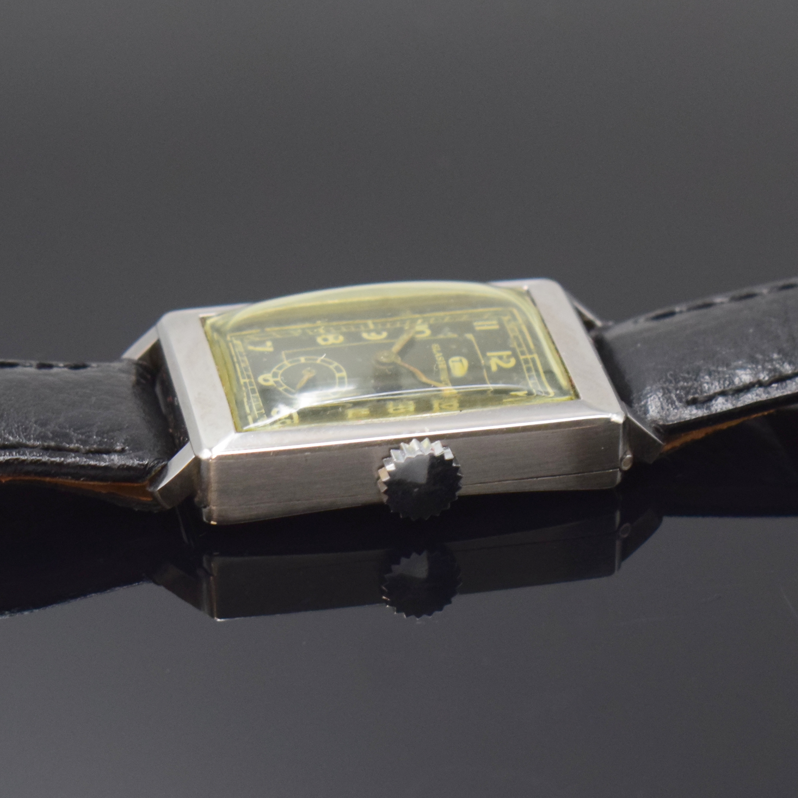 Detail b: TUTIMA rechteckige Armbanduhr in Stahl Kaliber UROFA 58, Deutschland um 1935, Handaufzug, Scharniergeh. rücks. bez."Uhrenfabrik AG Glashütte ...