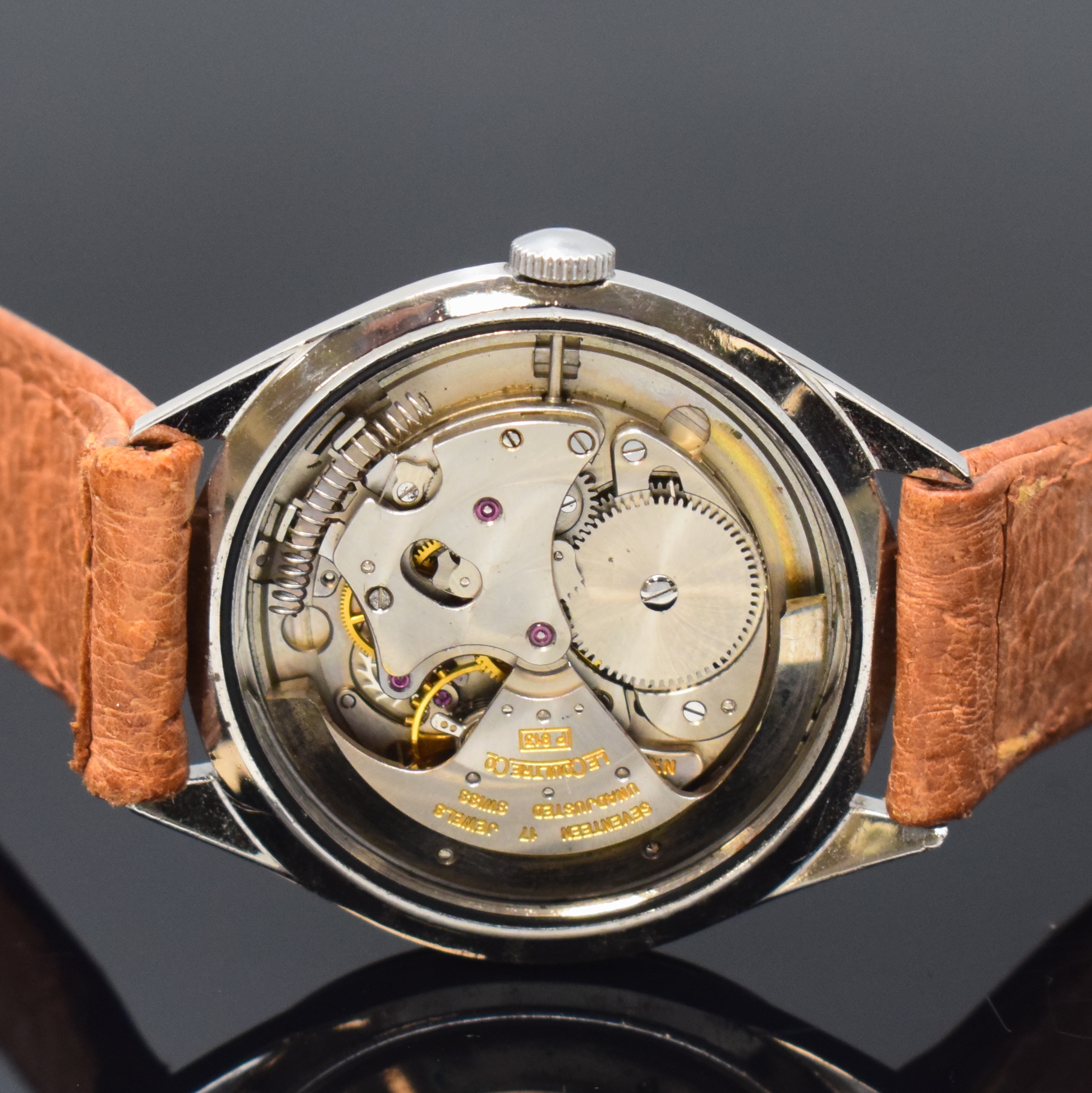 Detail d: LeCOULTRE Herrenarmbanduhr mit Hammerautomatik in Stahl, Schweiz 1950er Jahre, sign. Geh., Boden verschr., silb. Zifferbl. pat./fl., silb. Std.-Ind., ...