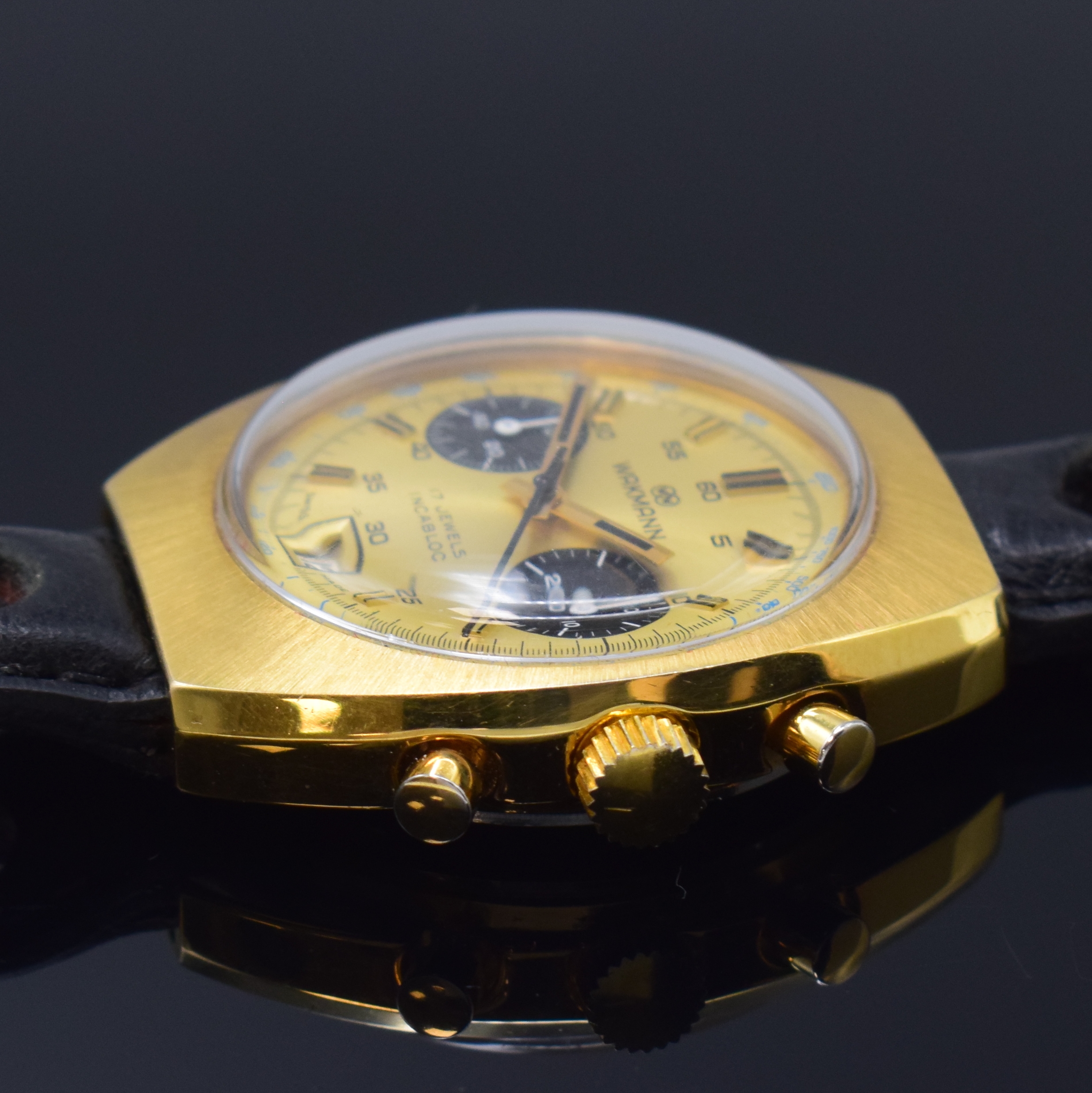 Detail b: WAKMANN / GIGANDET Herrenarmbanduhr mit Chronograph, Schweiz um 1970, Handaufzug, verg. Geh., Stahlboden verschr., gold. Zifferbl., schwarz. ...