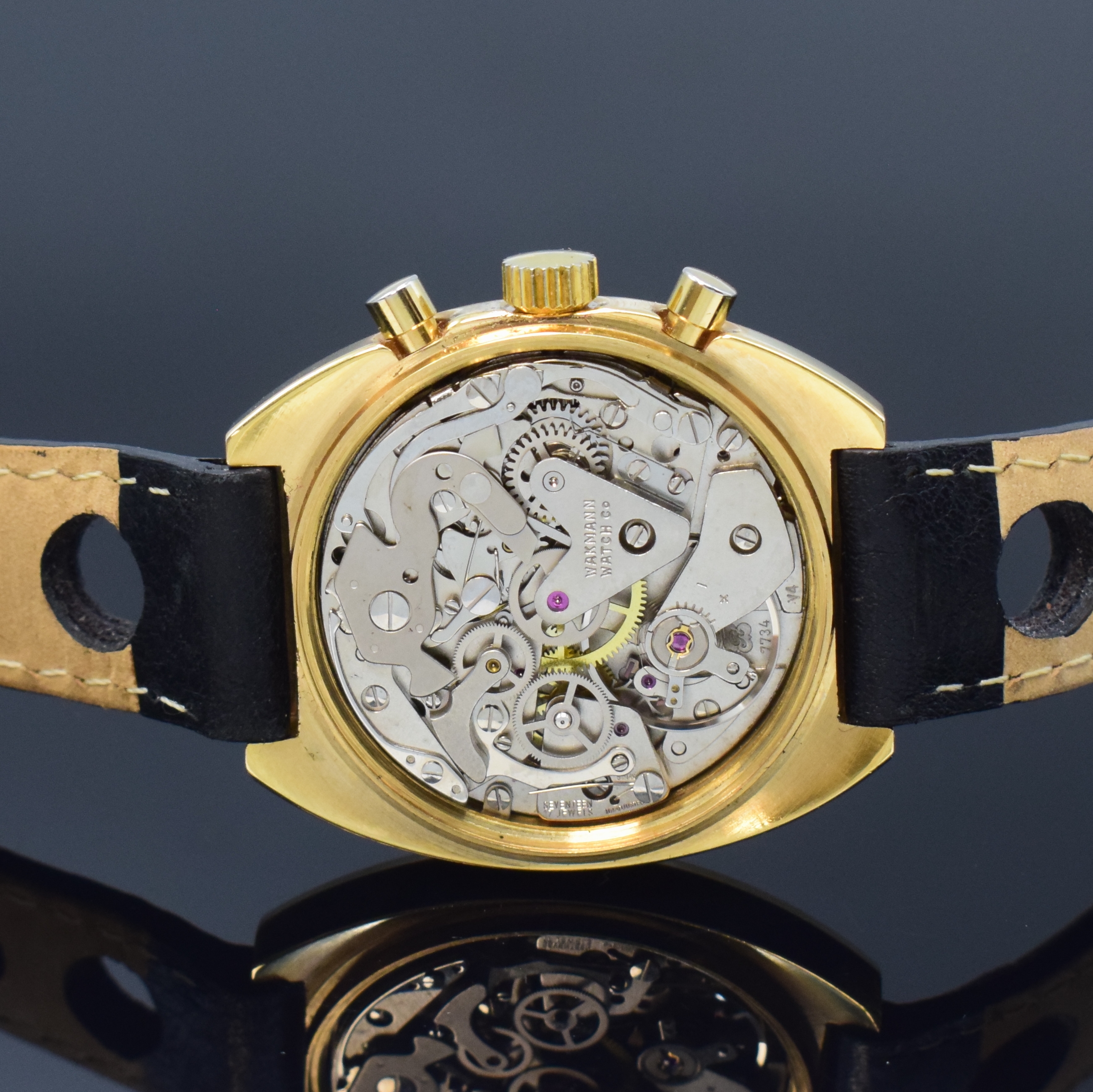 Detail d: WAKMANN / GIGANDET Herrenarmbanduhr mit Chronograph, Schweiz um 1970, Handaufzug, verg. Geh., Stahlboden verschr., gold. Zifferbl., schwarz. ...