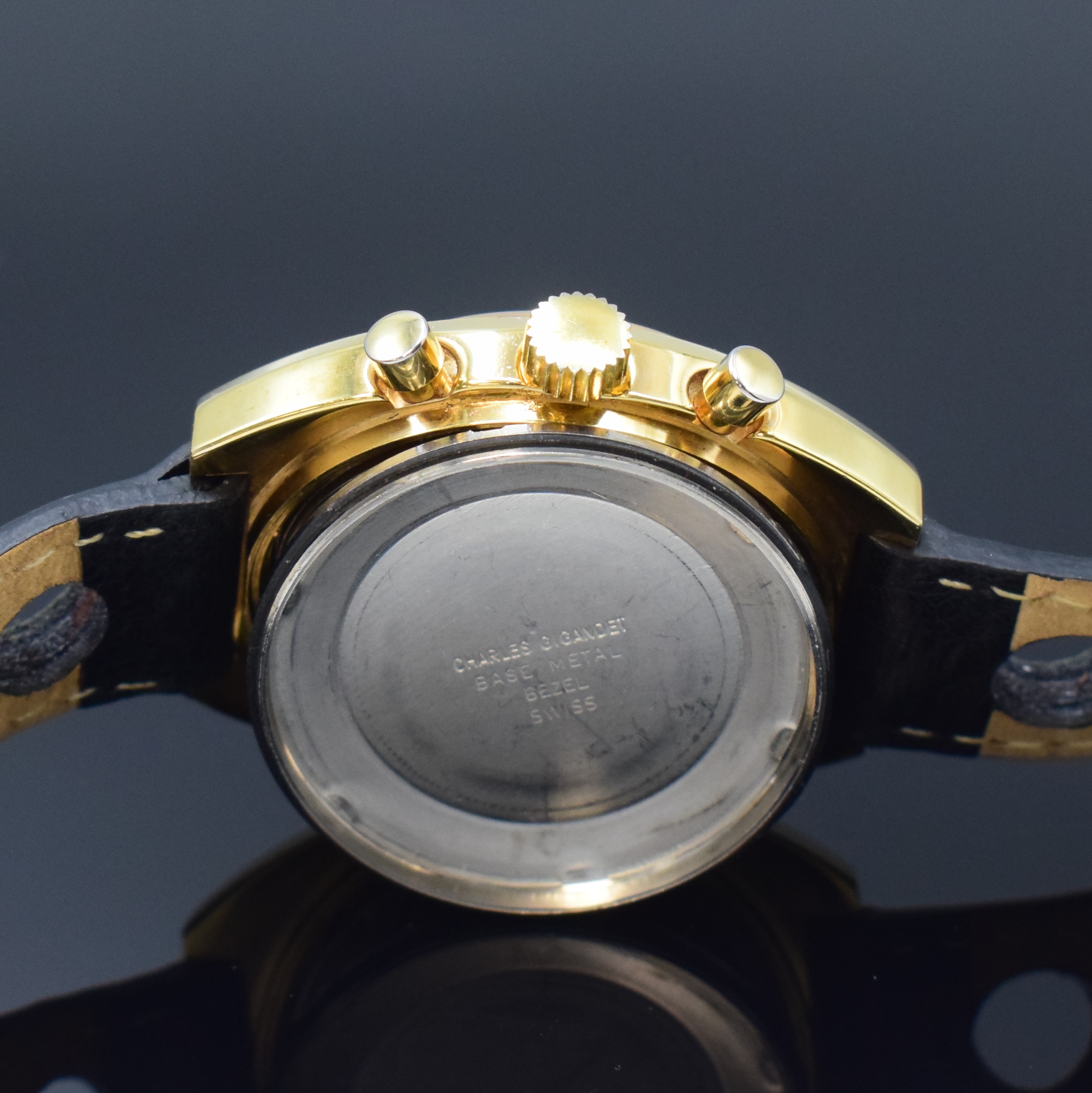 Detail e: WAKMANN / GIGANDET Herrenarmbanduhr mit Chronograph, Schweiz um 1970, Handaufzug, verg. Geh., Stahlboden verschr., gold. Zifferbl., schwarz. ...