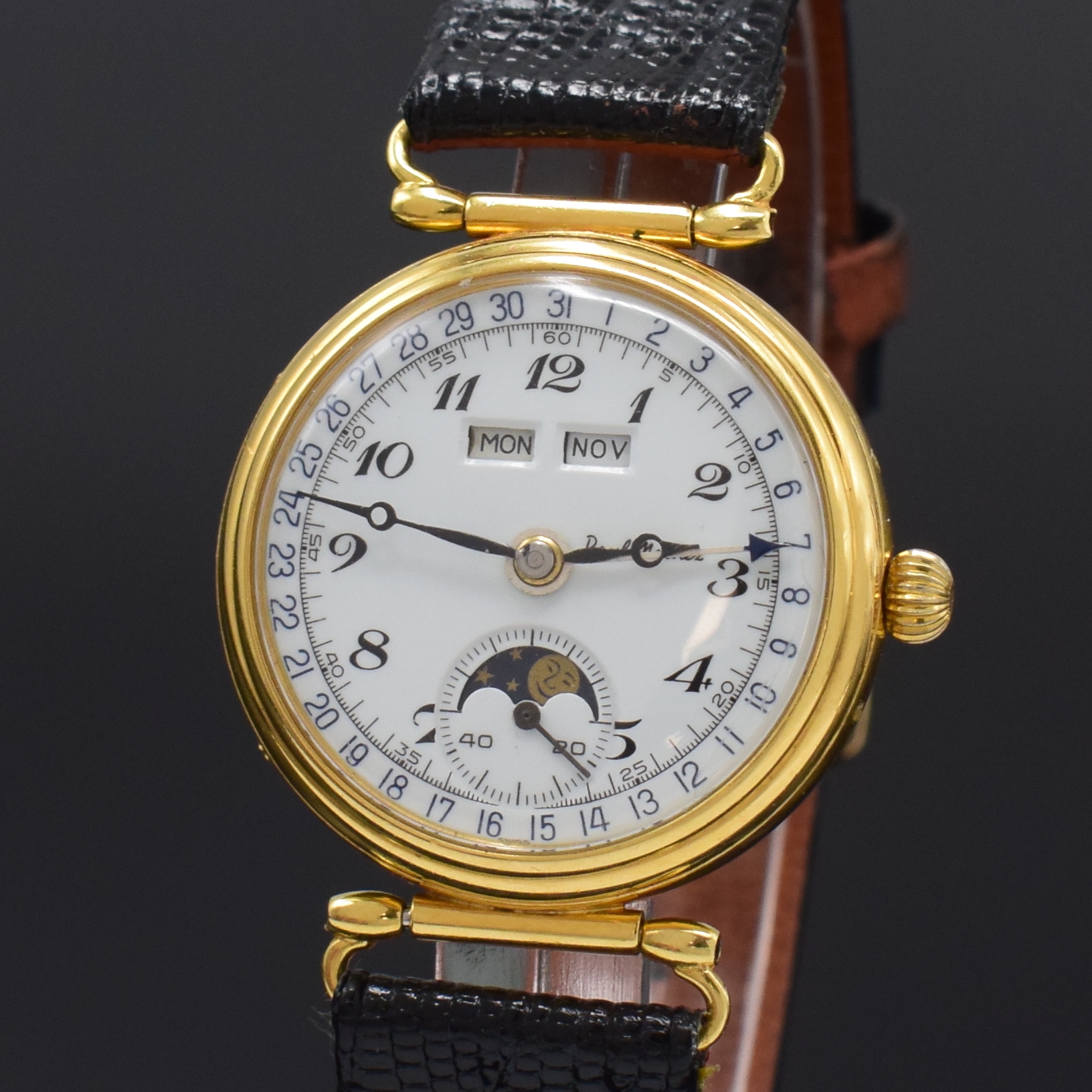 Detail a: PAUL MATHEZ Armbanduhr mit Vollkalender in GG 750/000, Schweiz um 1990, Handaufzug, 3-tlg. Geh. m. bewegl. Anstössen, Boden u. Glasrand aufgedr., ...