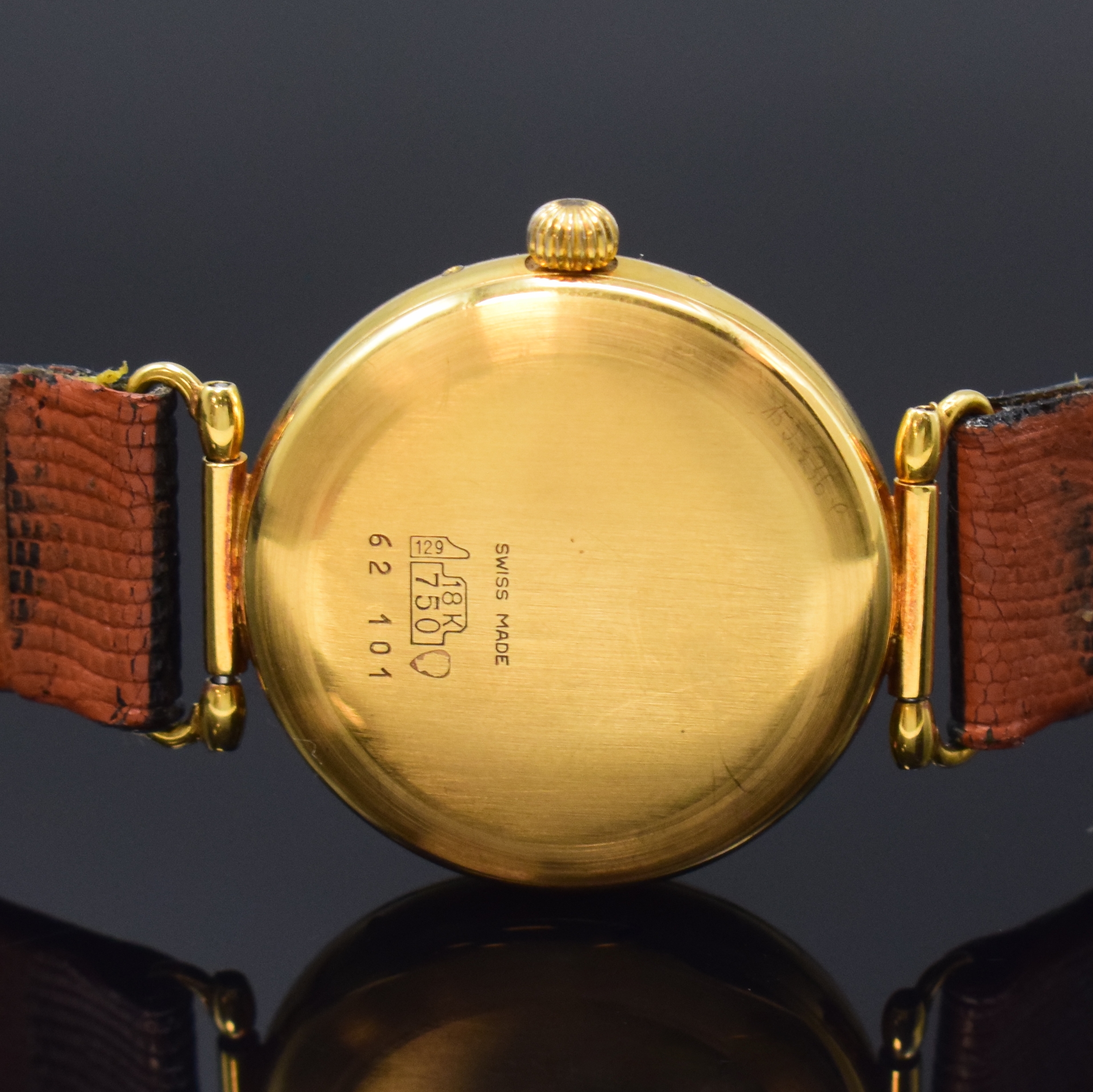 Detail c: PAUL MATHEZ Armbanduhr mit Vollkalender in GG 750/000, Schweiz um 1990, Handaufzug, 3-tlg. Geh. m. bewegl. Anstössen, Boden u. Glasrand aufgedr., ...