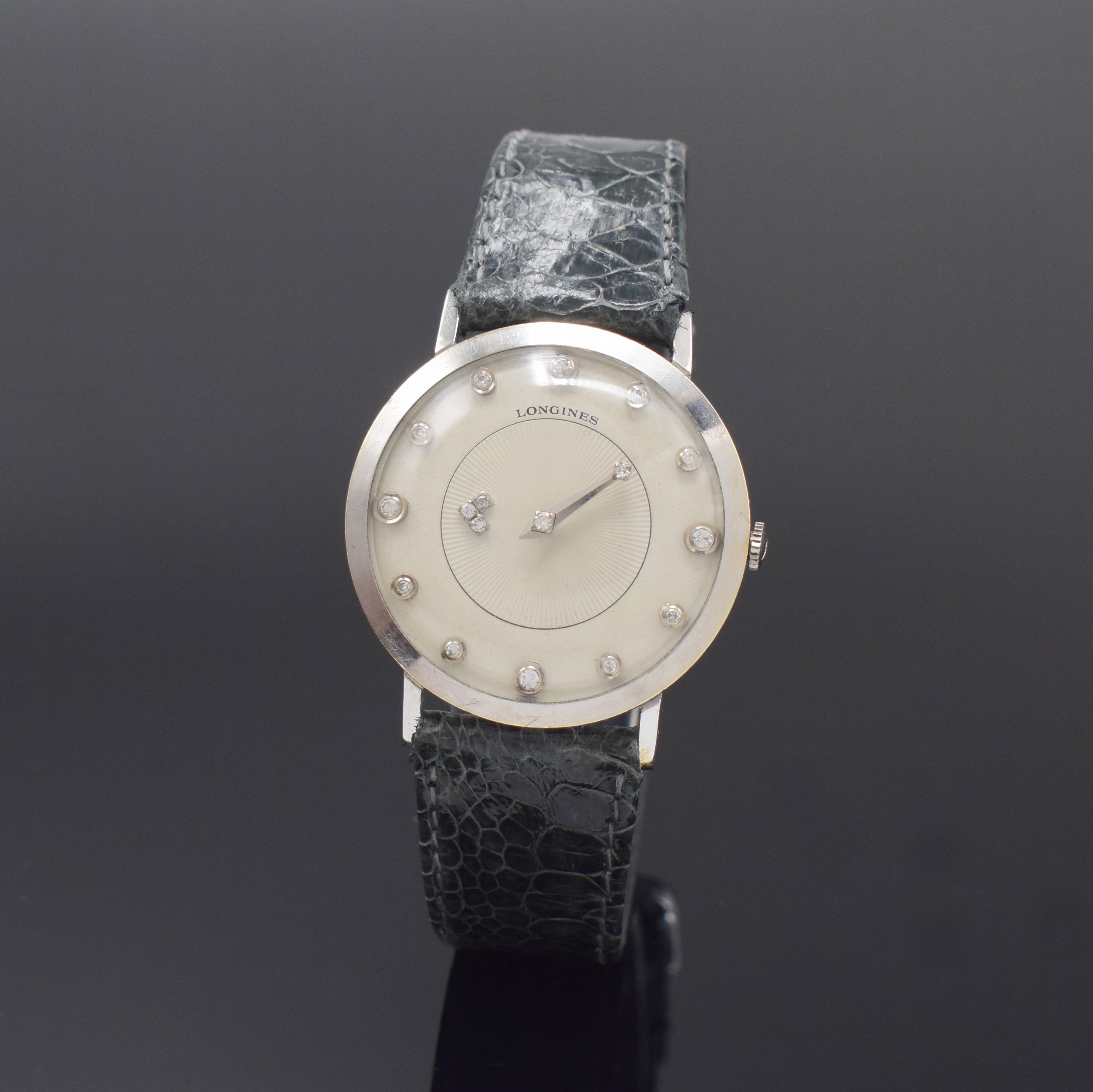 LONGINES Mysterieuse Armbanduhr in WG 585/000, Schweiz/USA um 1958, Handaufzug, 2-tlg. Geh., Boden aufgedr., orig. Krone, matt-silb. Zifferbl., ...