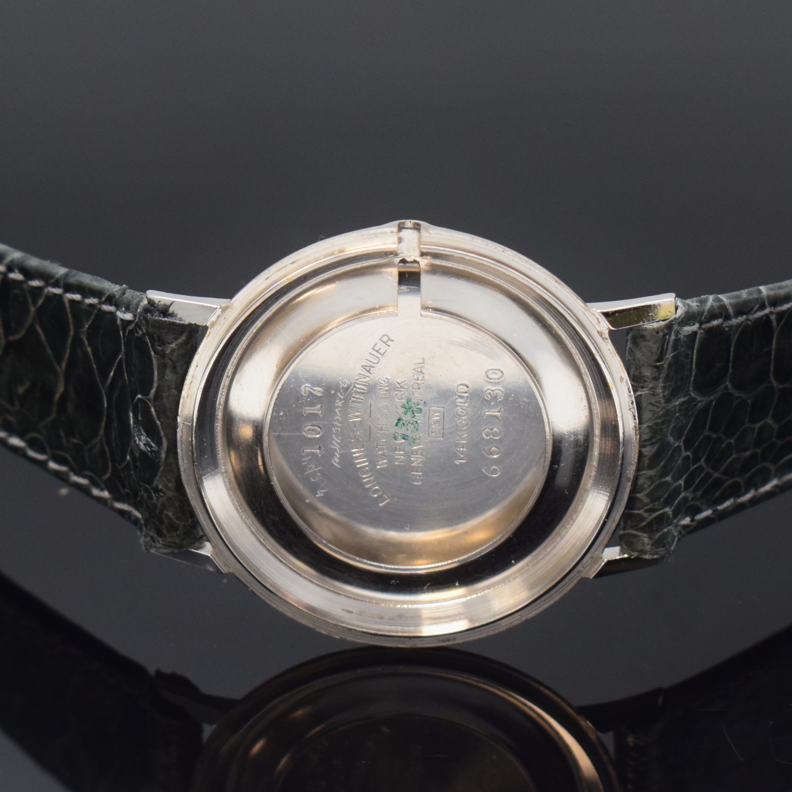 Detail d: LONGINES Mysterieuse Armbanduhr in WG 585/000, Schweiz/USA um 1958, Handaufzug, 2-tlg. Geh., Boden aufgedr., orig. Krone, matt-silb. Zifferbl., ...