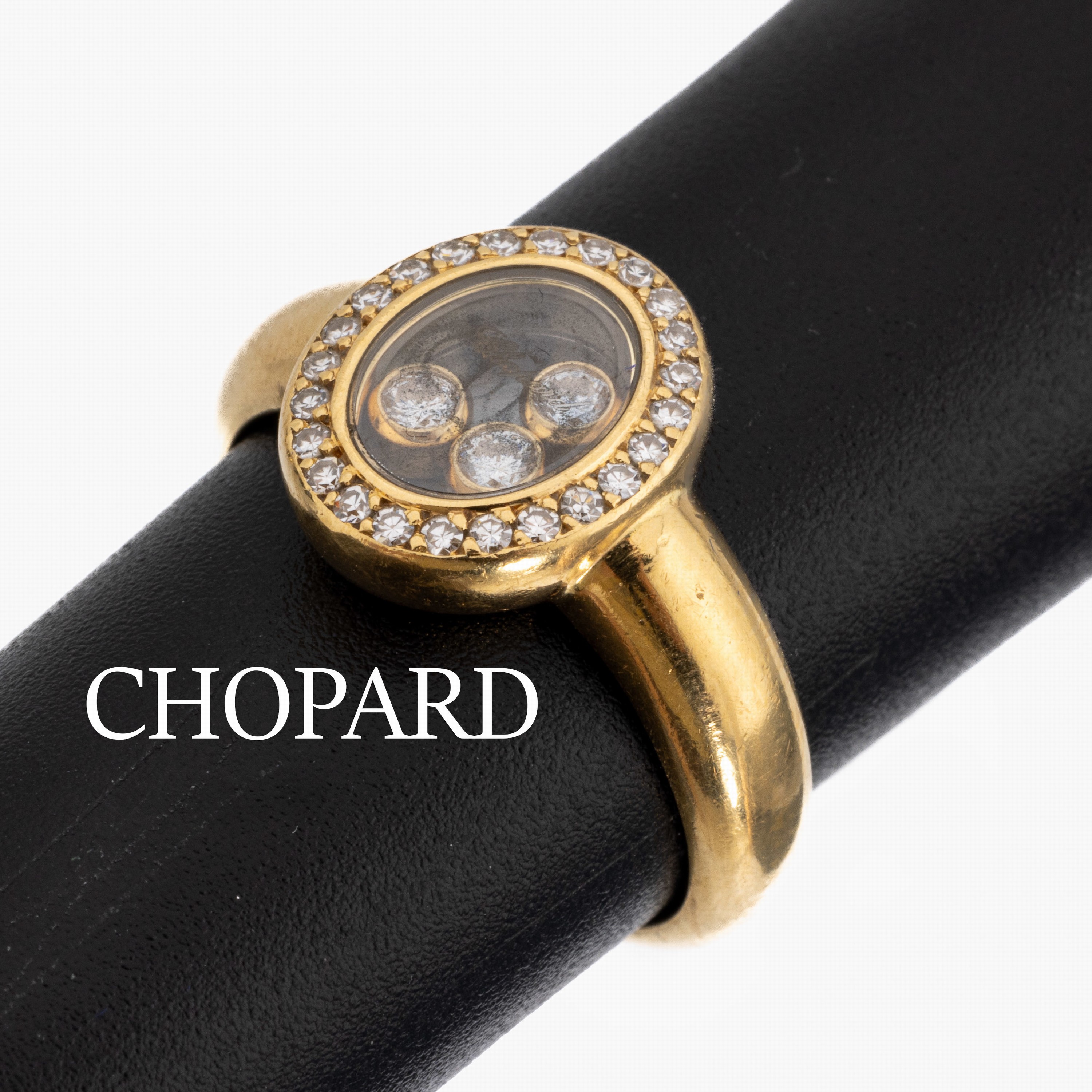 18 kt Gold CHOPARD Diamant-Ring, GG 750/000, Serie Happy Diamonds, 3 Brillanten beweglich hinter Glas und 24 8/8- Diamanten zus. ca. 0.30 ct ...