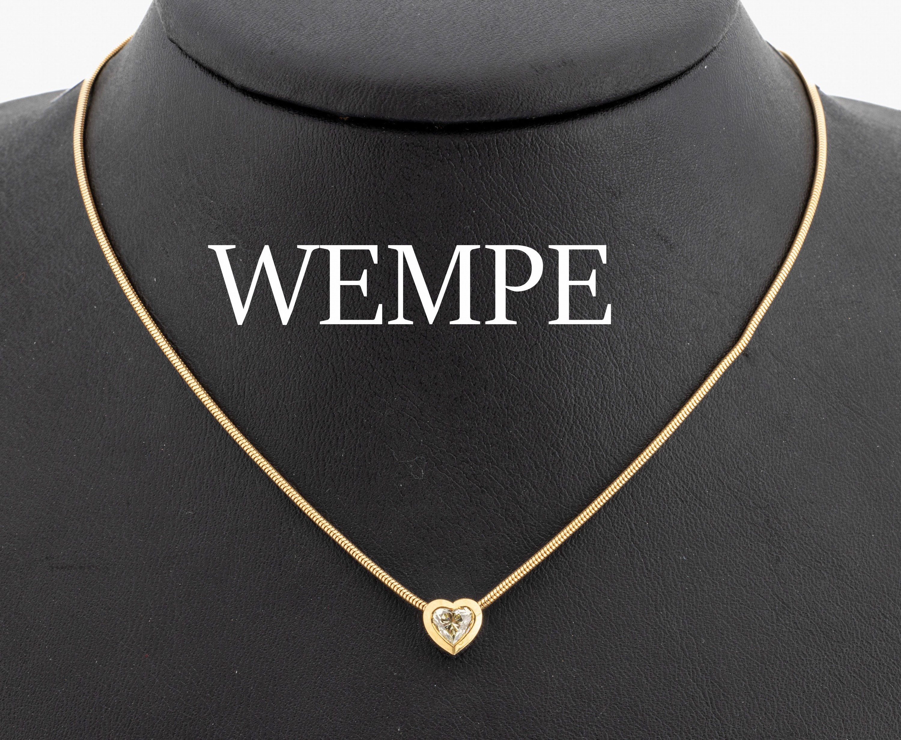 18 kt Gold WEMPE Diamant-Anhänger, GG/WG 750/000, Diamant-Herz ca. 0.40 ct light yellow/si, an 18 kt Gold Schlangenkette, GG 750/000, L ca. 42 cm, ...