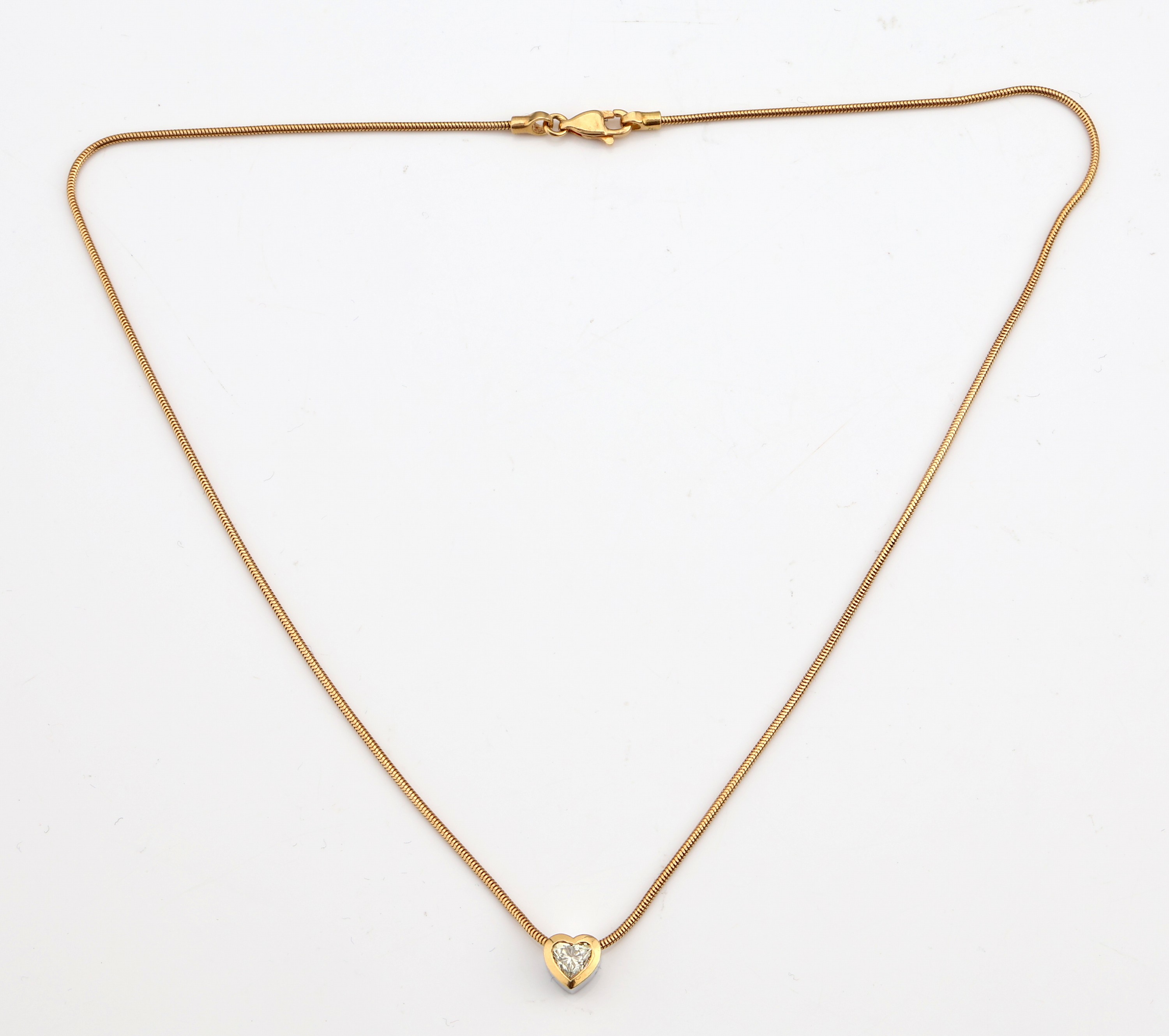Detail a: 18 kt Gold WEMPE Diamant-Anhänger, GG/WG 750/000, Diamant-Herz ca. 0.40 ct light yellow/si, an 18 kt Gold Schlangenkette, GG 750/000, L ca. 42 cm, ...