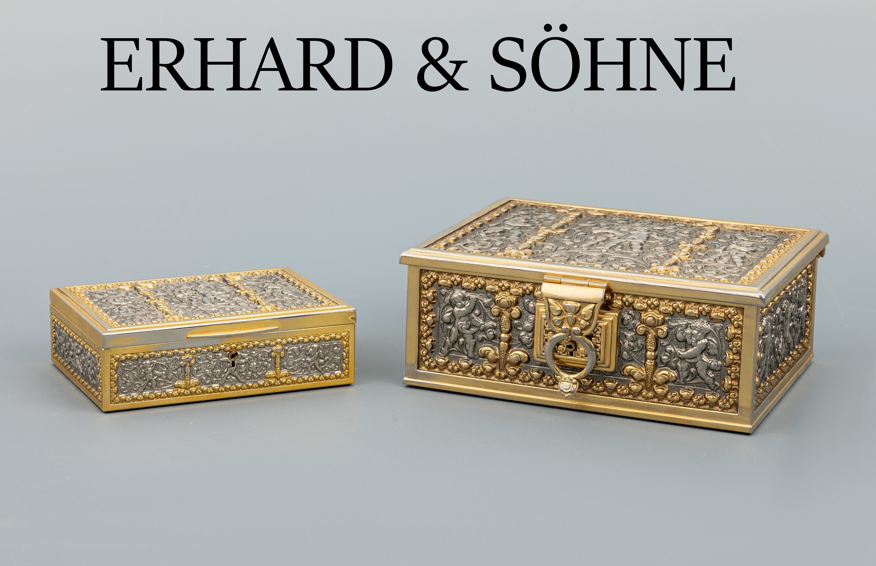 Set 2 Deckeldosen, deutsch um 1890, Metall teilvergoldet, Schwäbisch Gmünd, ERHARD & SÖHNE, reliefiert, Putti zwischen floralen Elementen, innen ...