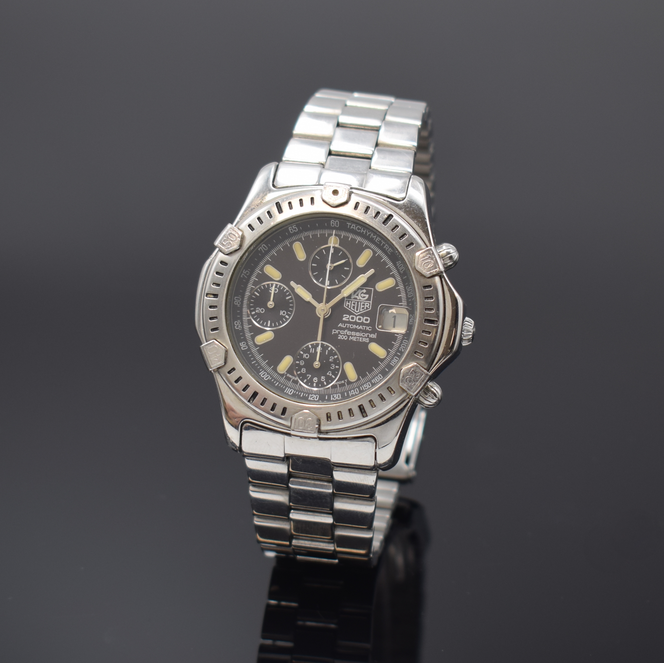 TAG HEUER 2000 Armbandchronograph, Automatik, Schweiz um 1992, Edelstahlgeh. inkl. orig. Gliederband m. Faltschl., Boden verschr., schwarzes ...