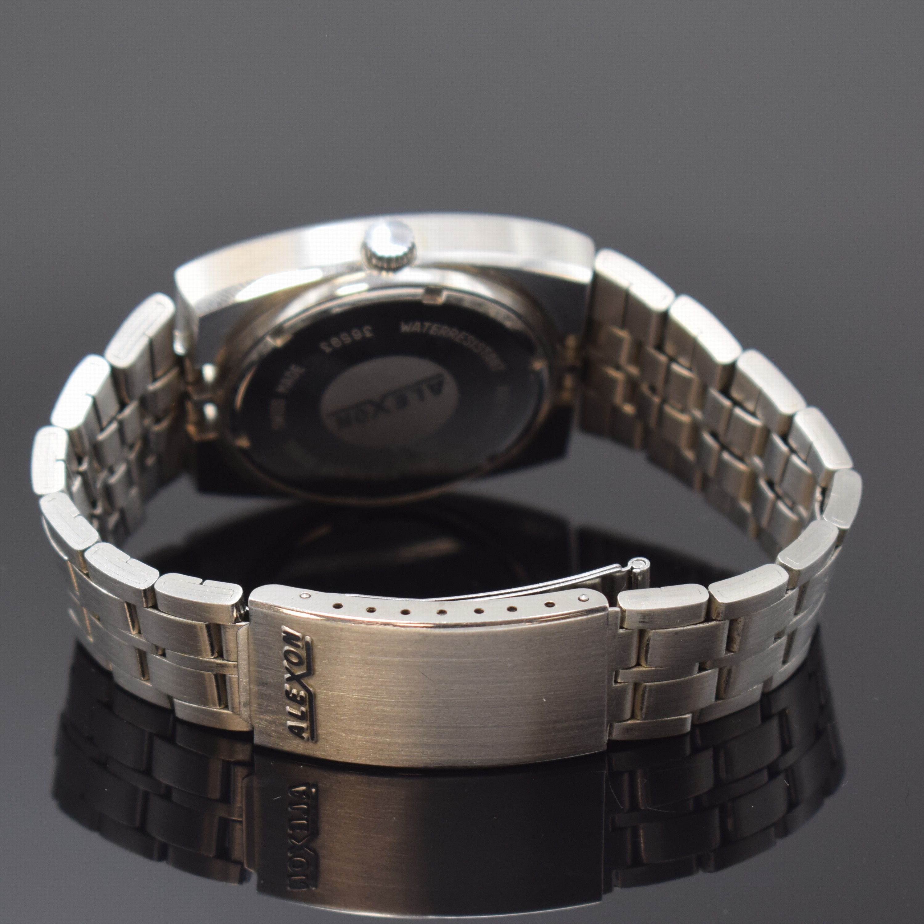 Detail b: ALEXON Herrenarmbanduhr, Automatik, Schweiz um 1965, Edelstahlgeh. inkl. orig. Gliederband m. Faltschl., Boden verschr., graues Zifferbl. m. aufges. ...