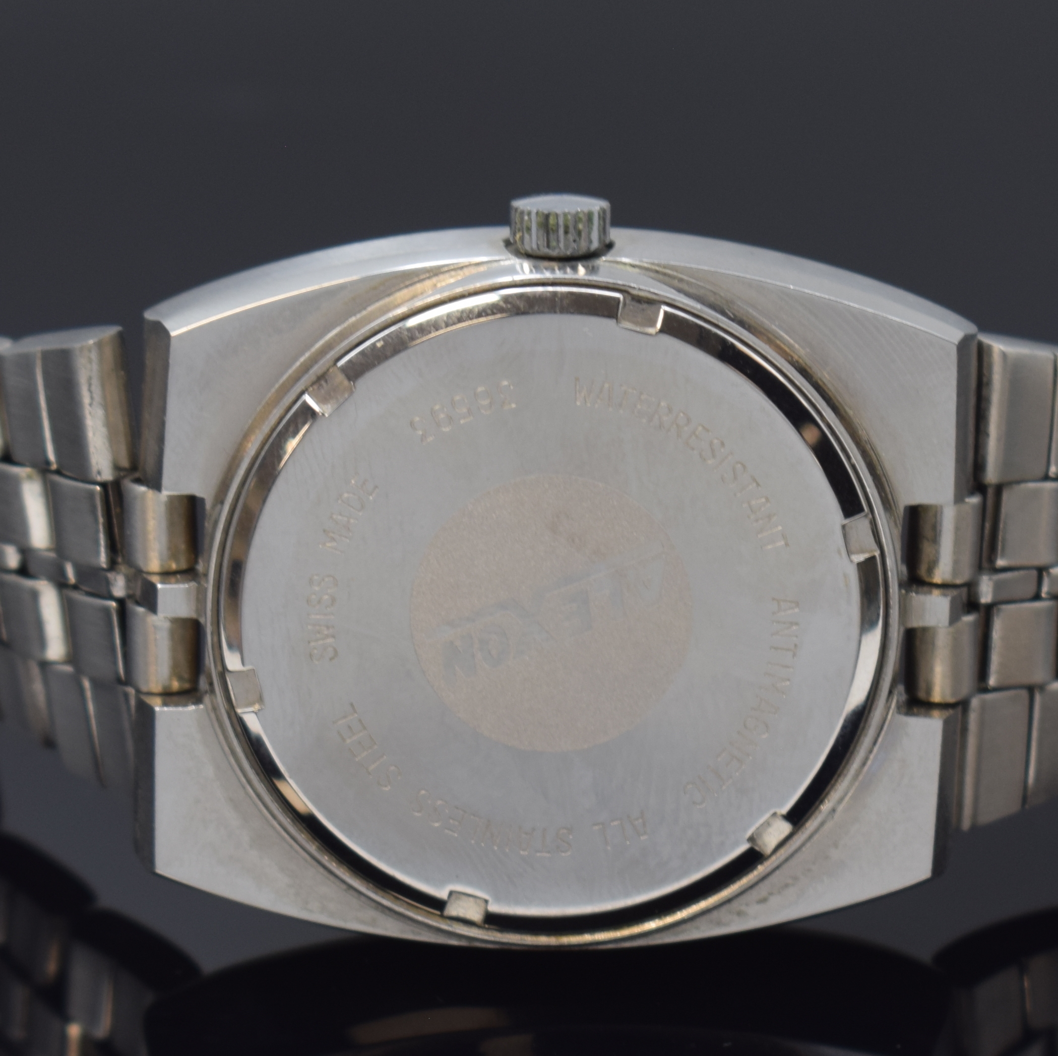 Detail c: ALEXON Herrenarmbanduhr, Automatik, Schweiz um 1965, Edelstahlgeh. inkl. orig. Gliederband m. Faltschl., Boden verschr., graues Zifferbl. m. aufges. ...