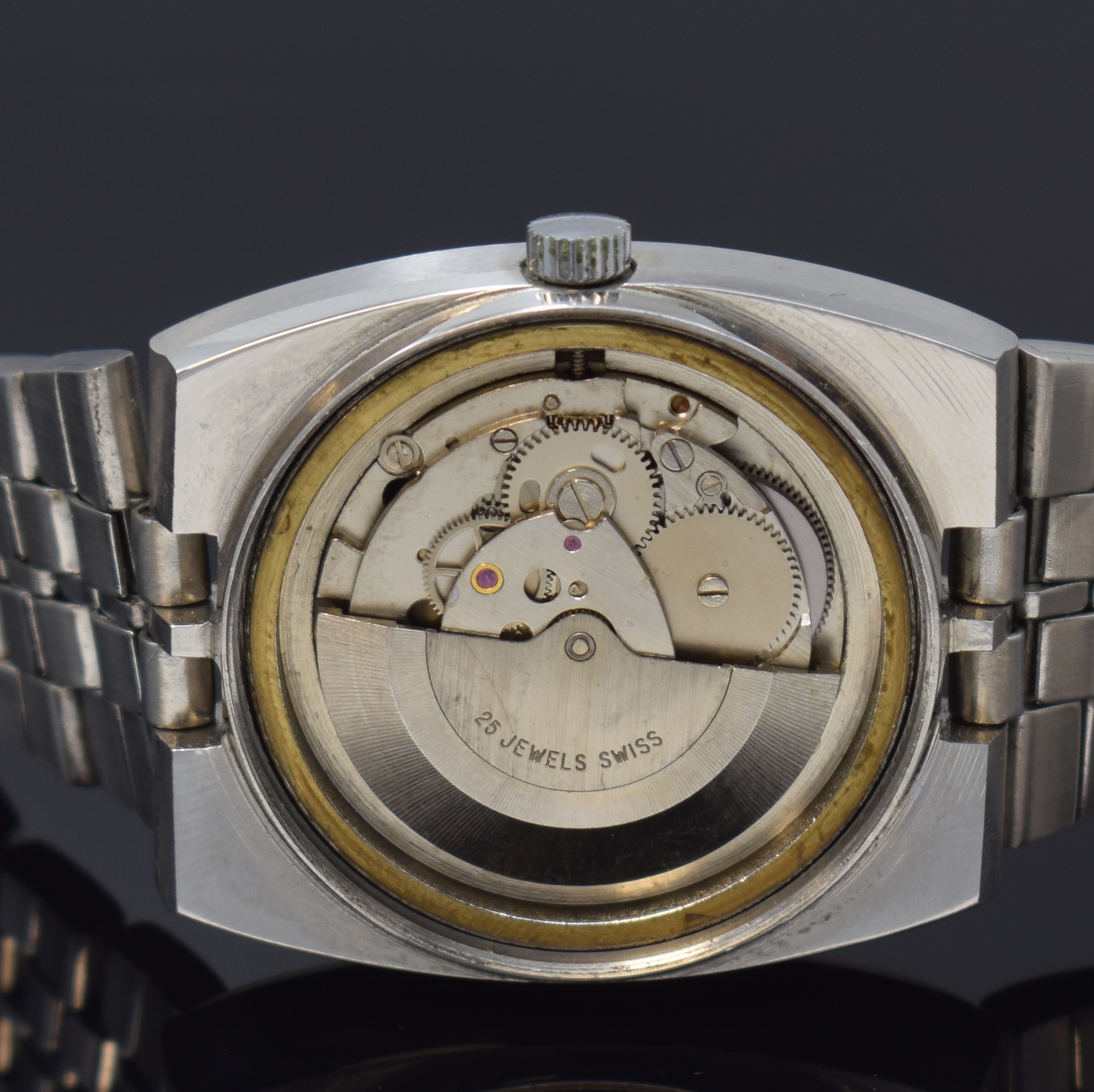Detail d: ALEXON Herrenarmbanduhr, Automatik, Schweiz um 1965, Edelstahlgeh. inkl. orig. Gliederband m. Faltschl., Boden verschr., graues Zifferbl. m. aufges. ...