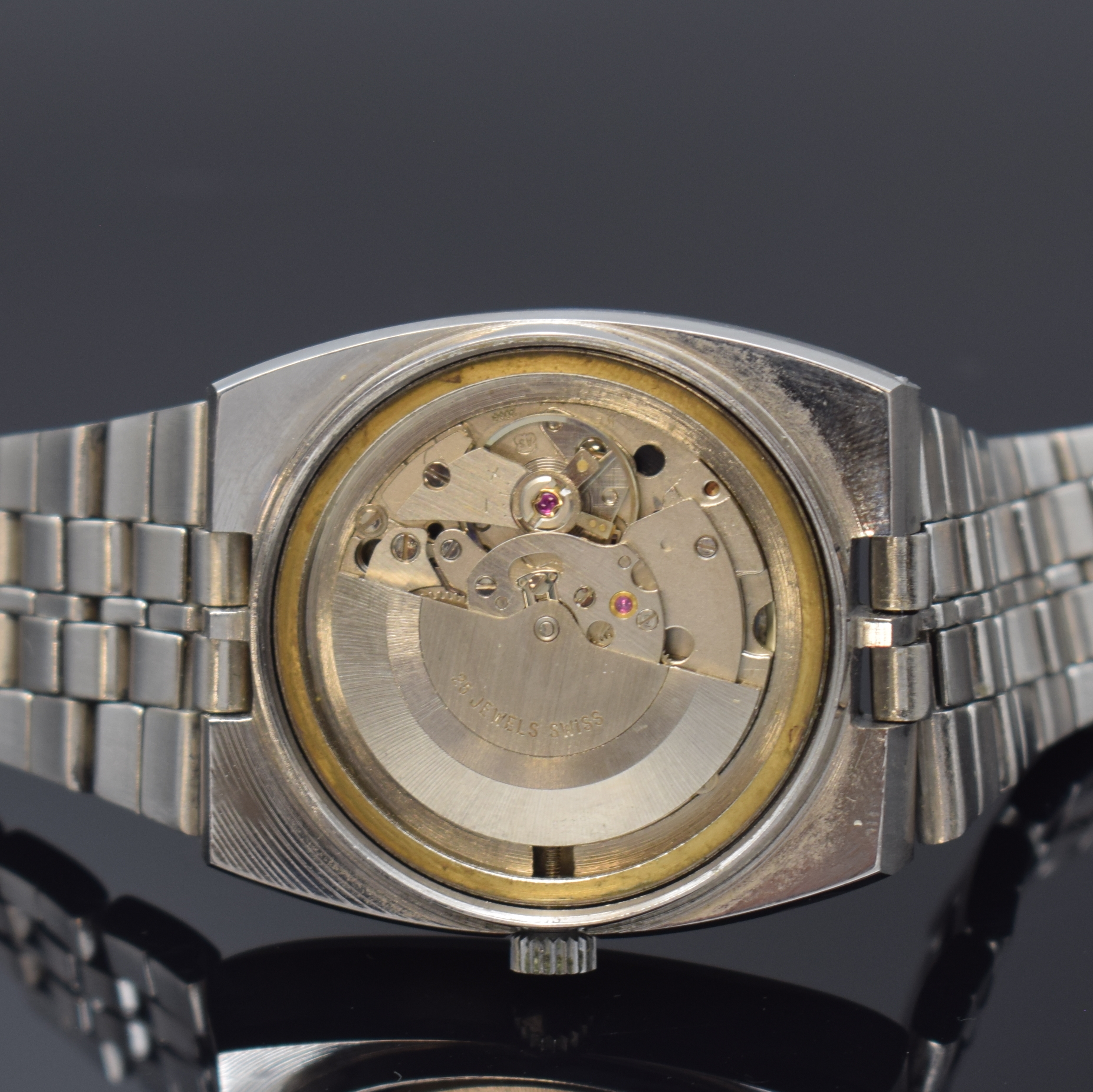 Detail e: ALEXON Herrenarmbanduhr, Automatik, Schweiz um 1965, Edelstahlgeh. inkl. orig. Gliederband m. Faltschl., Boden verschr., graues Zifferbl. m. aufges. ...