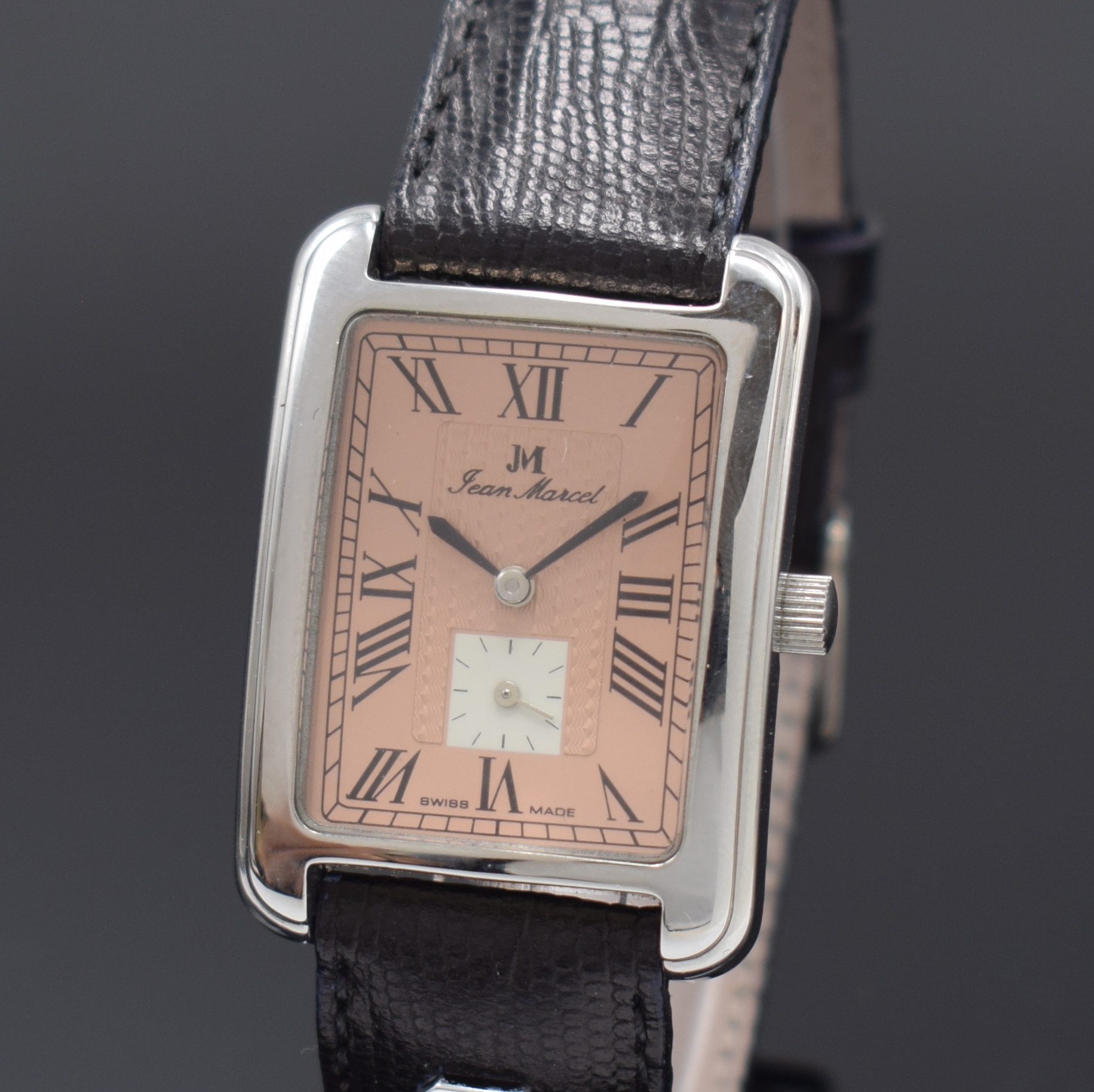 Detail a: JEAN MARCEL rechteckige Armbanduhr in Stahl, Schweiz um 1990, Handaufzug, beids. vergl. Geh., Boden 4-fach verschr., lachsfarb. Zifferbl. m. ...