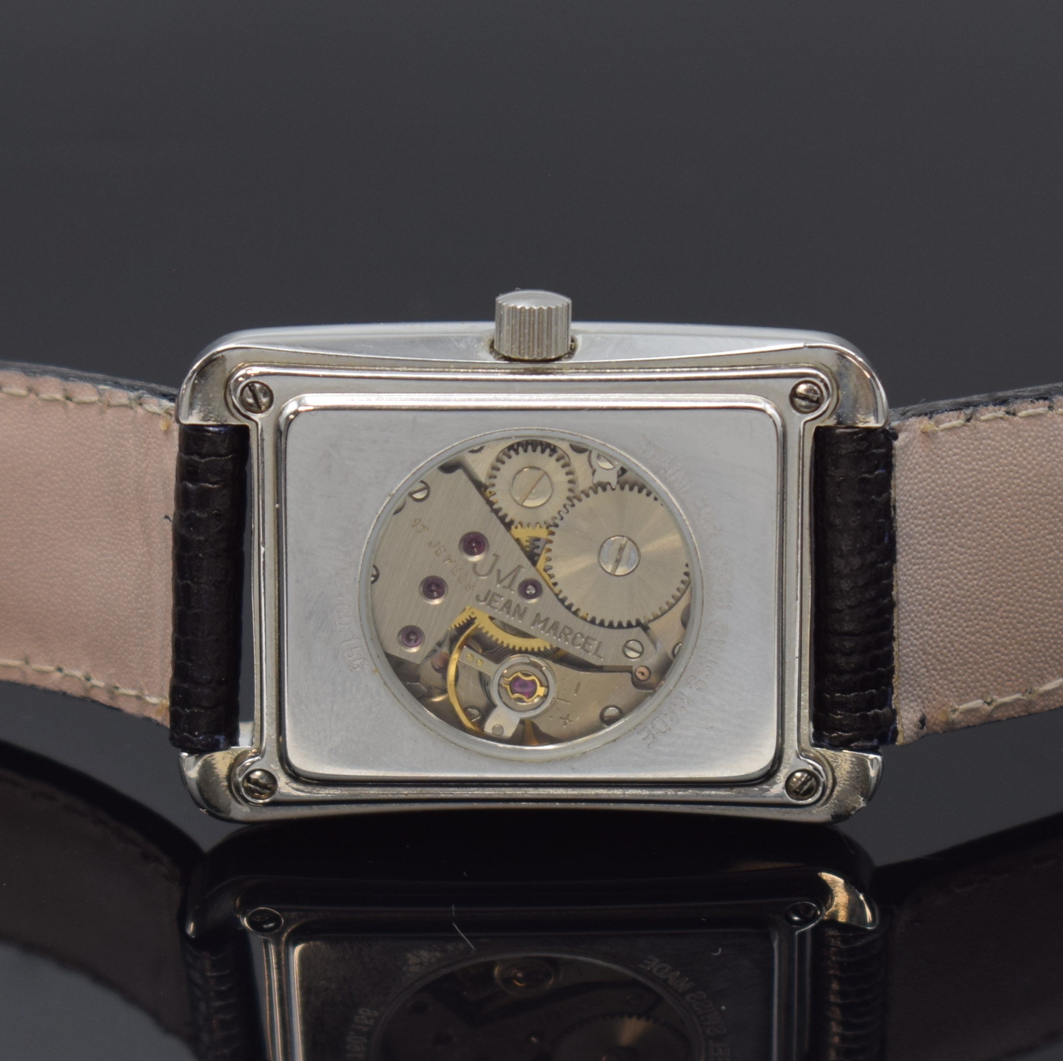 Detail d: JEAN MARCEL rechteckige Armbanduhr in Stahl, Schweiz um 1990, Handaufzug, beids. vergl. Geh., Boden 4-fach verschr., lachsfarb. Zifferbl. m. ...