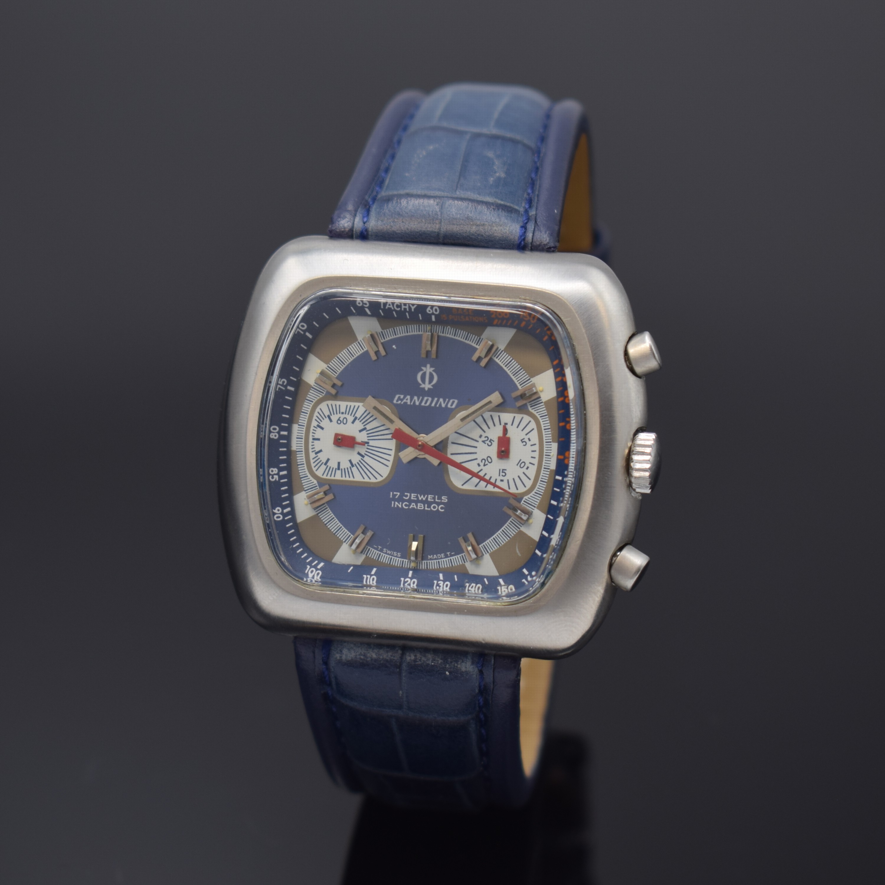 CANDINO Armbandchronograph in Stahl, Schweiz um 1975, Handaufzug, satiniertes Geh., Boden verschr., blaues Zifferbl., cremefarb. Minuterie u. ...