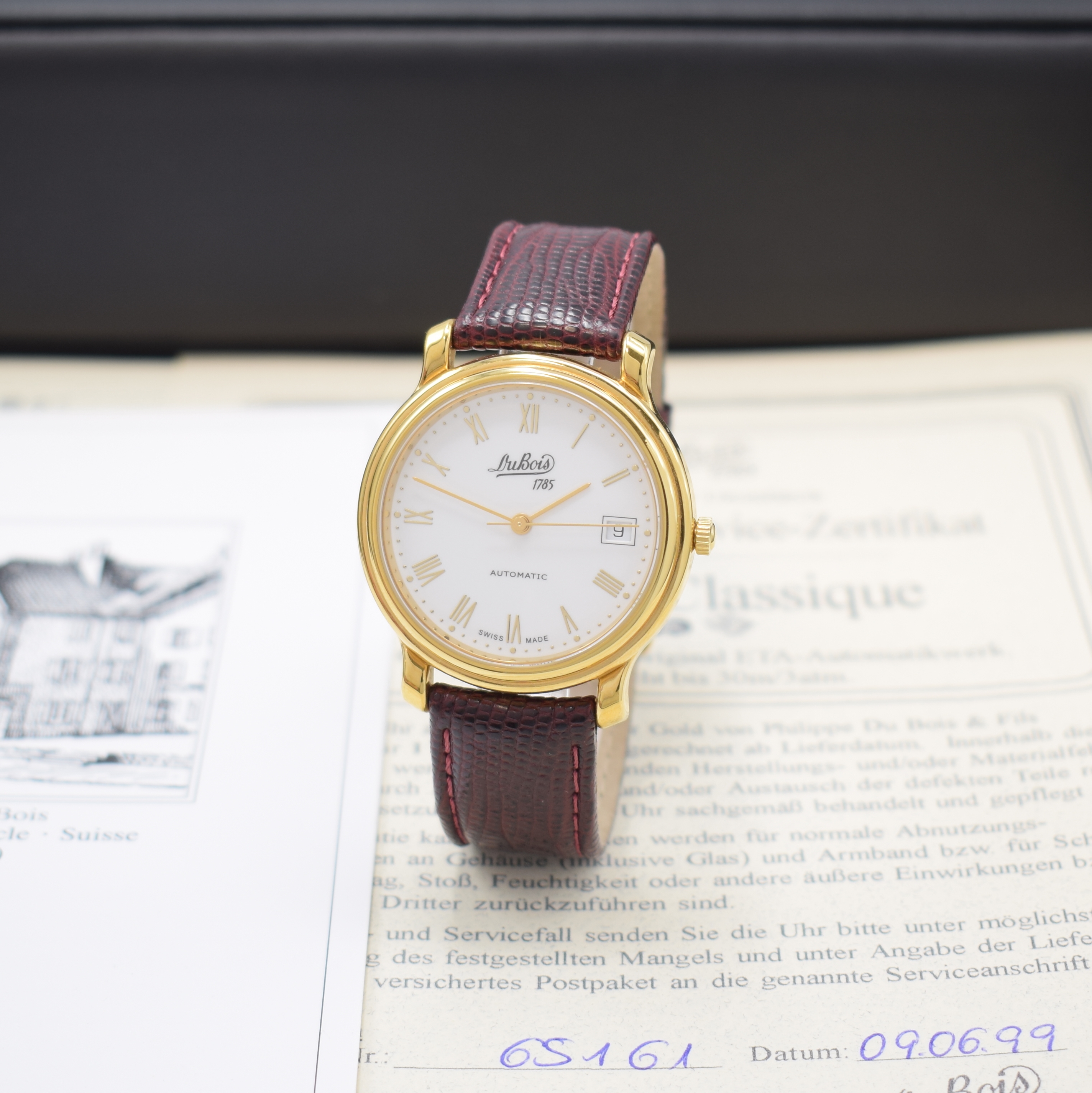 DU BOIS Armbanduhr in GG 750/000, Schweiz lt. orig. Pap. verk. 1999, Automatik, beids. vergl. Geh., Boden 6-fach verschr., cremefarb. Zifferbl., ...
