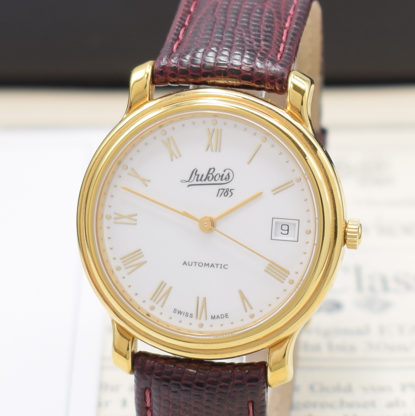Detail a: DU BOIS Armbanduhr in GG 750/000, Schweiz lt. orig. Pap. verk. 1999, Automatik, beids. vergl. Geh., Boden 6-fach verschr., cremefarb. Zifferbl., ...
