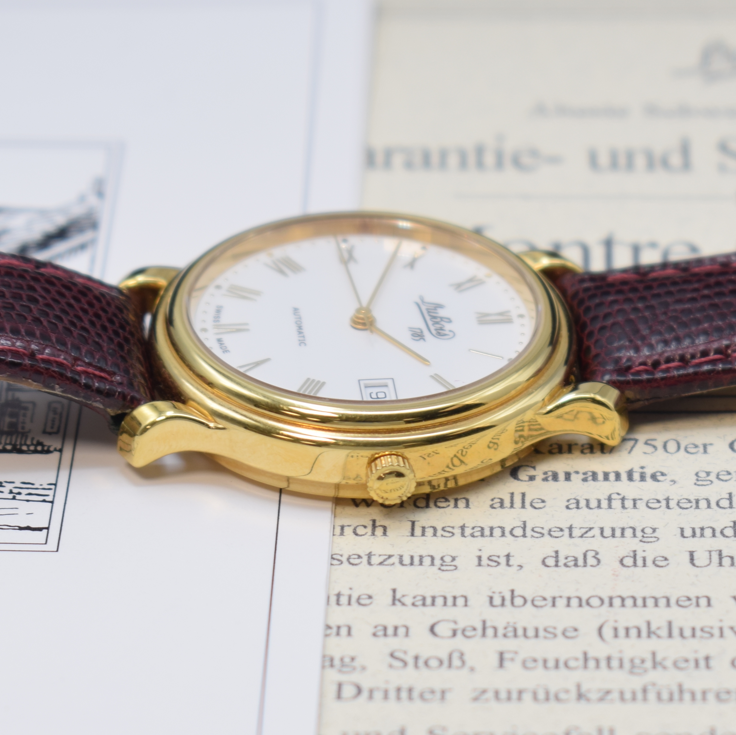 Detail b: DU BOIS Armbanduhr in GG 750/000, Schweiz lt. orig. Pap. verk. 1999, Automatik, beids. vergl. Geh., Boden 6-fach verschr., cremefarb. Zifferbl., ...