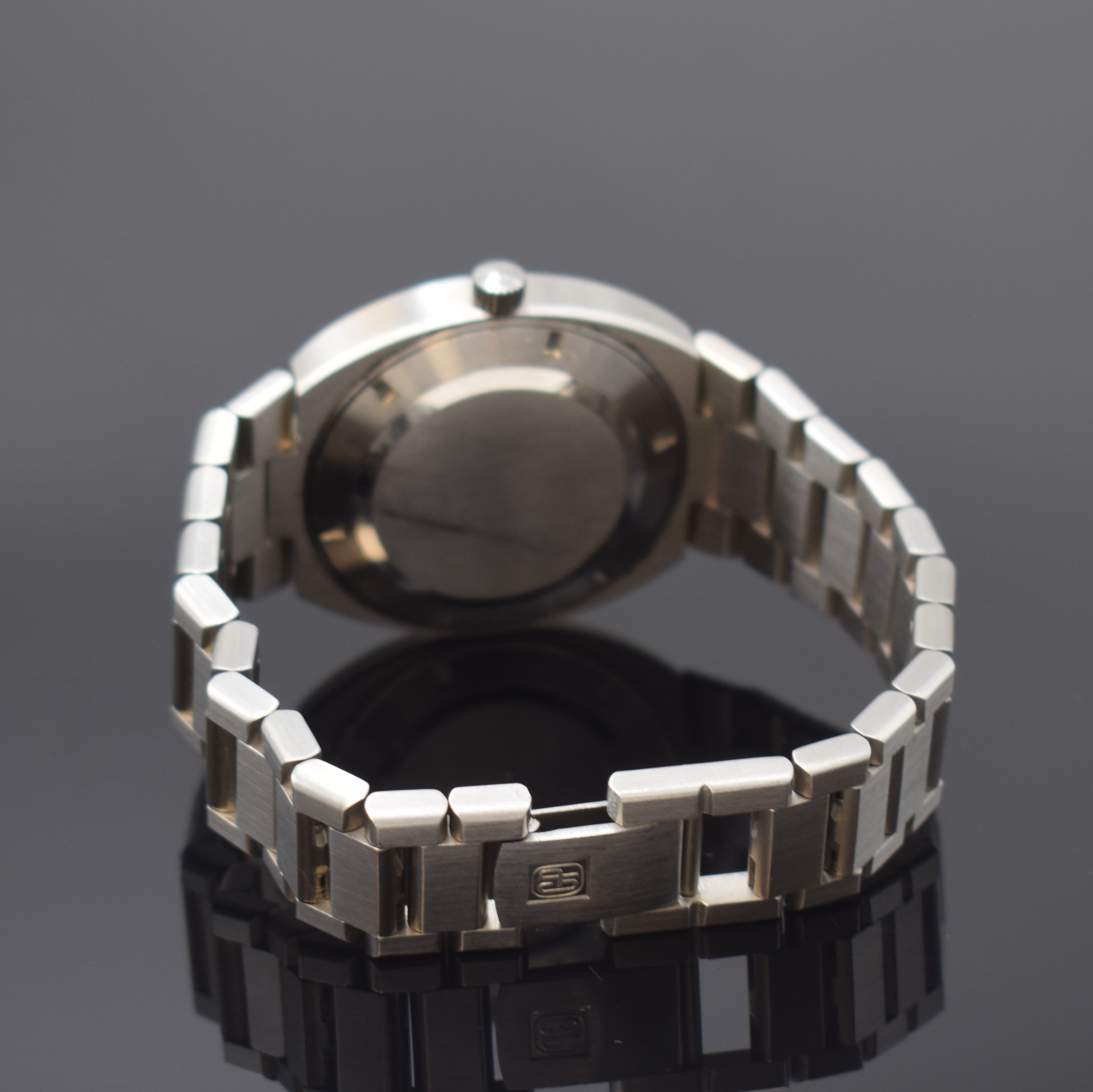 Detail b: GIRARD PERREGAUX Gyromatic Herrenarmbanduhr in Stahl/Stahlband, Schweiz um 1975, Automatik, verschr. Geh. m. integr. orig. Band, silb. ...