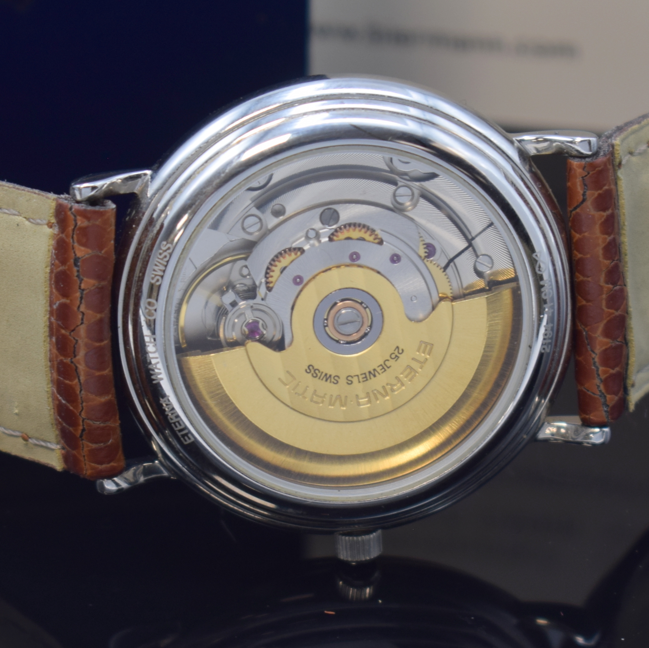 Detail e: ETERNA-MATIC Armbanduhr in Stahl, Schweiz um 2000, Automatik, beids. vergl. Geh., Boden aufgedr., silb. Zifferbl., silb. Indizes u. Zeiger, Datum b. ...