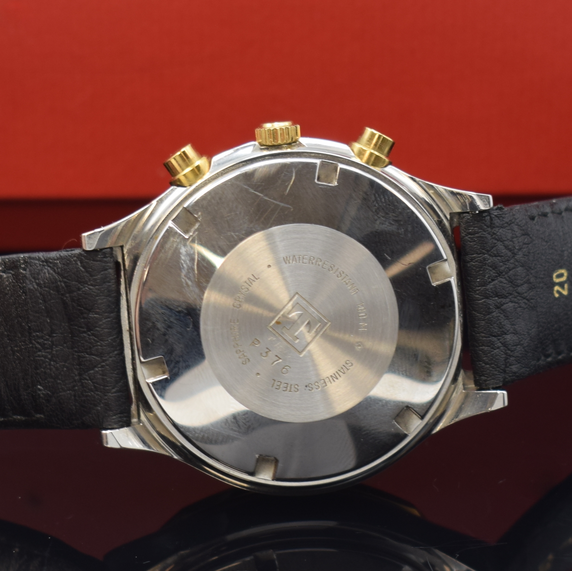 Detail d: TISSOT PRX Armbandchronograph, Schweiz um 1990, Automatik, Stahlgeh. m. verg. 12-eckiger Lünette, Boden verschr., schwarz. Waffel- Zifferbl., gold. ...